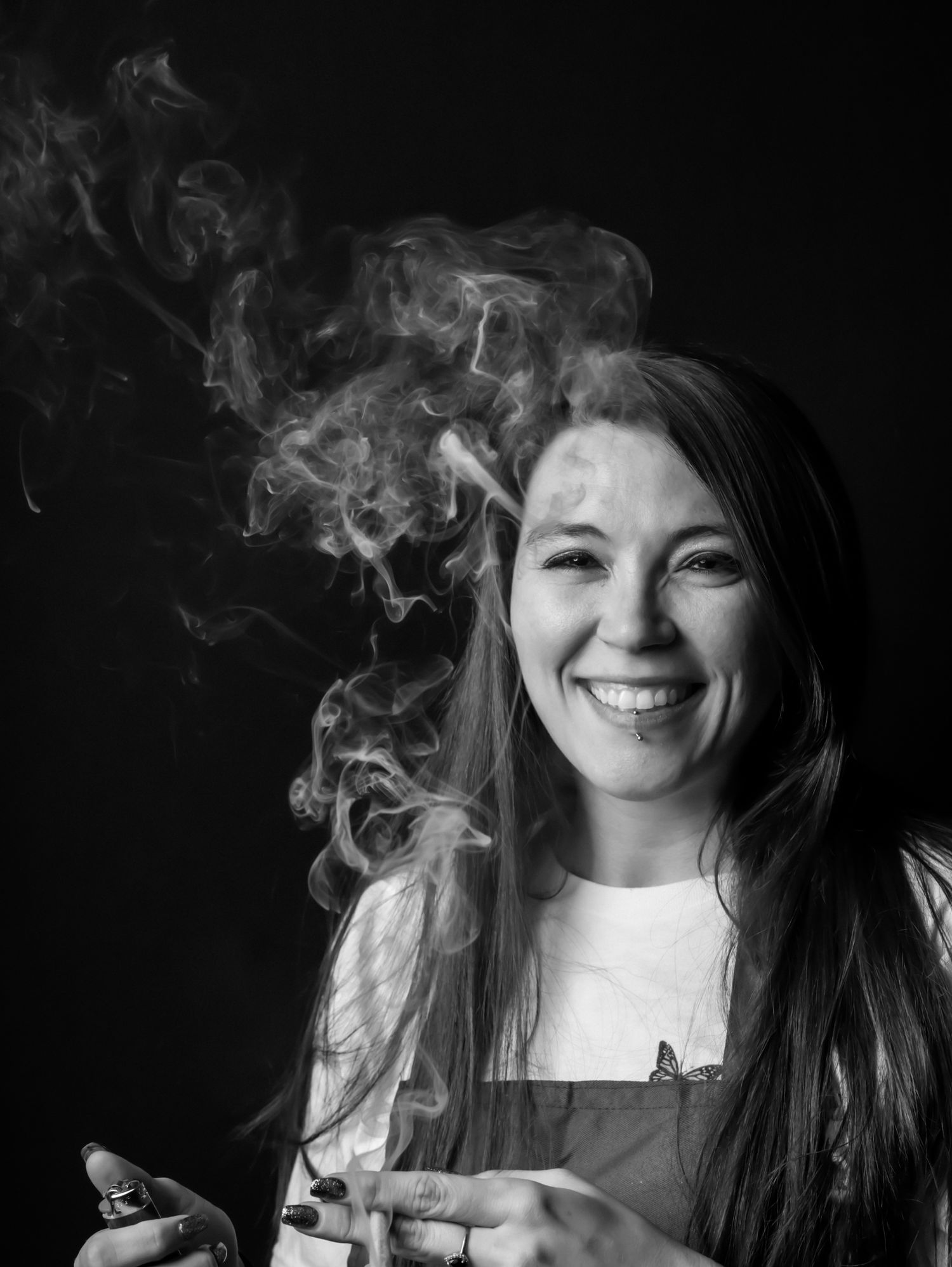 Black and white portrait series with smoke effects against dark background.