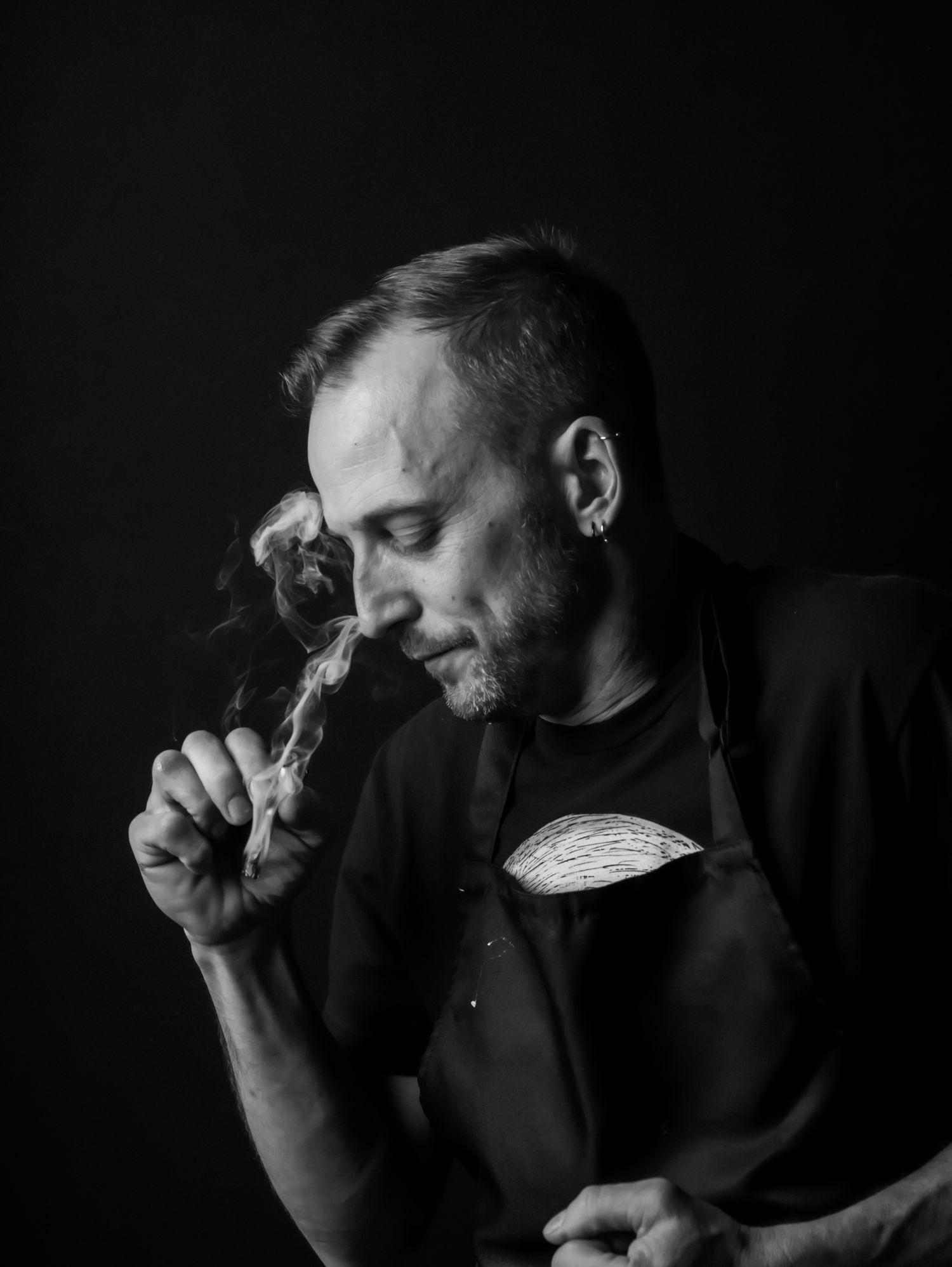 Moody black and white photography series featuring smoke and shadows.