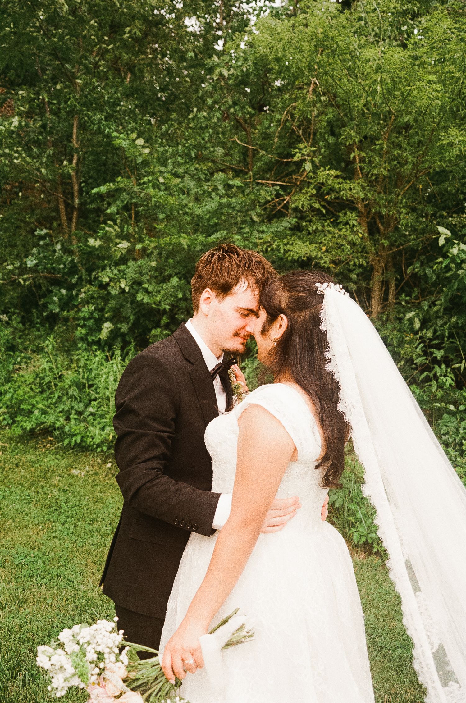 Romantic outdoor summer wedding on 35MM film photographer northern Indiana candid documentary true to life lush greens
