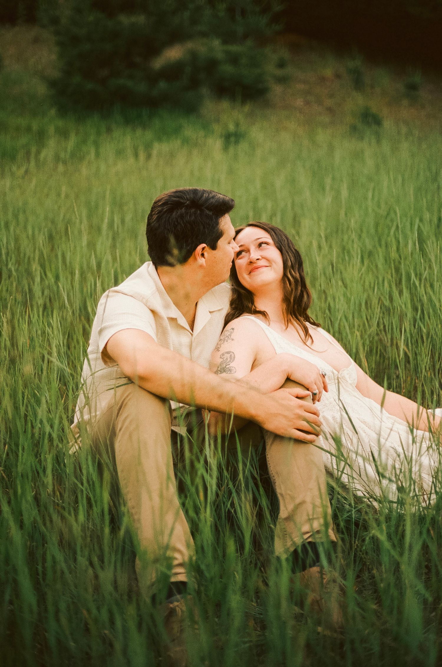 Romantic gentle summer engagement on 35MM film photographer northern Indiana candid documentary true to life golden sunlight lush greens