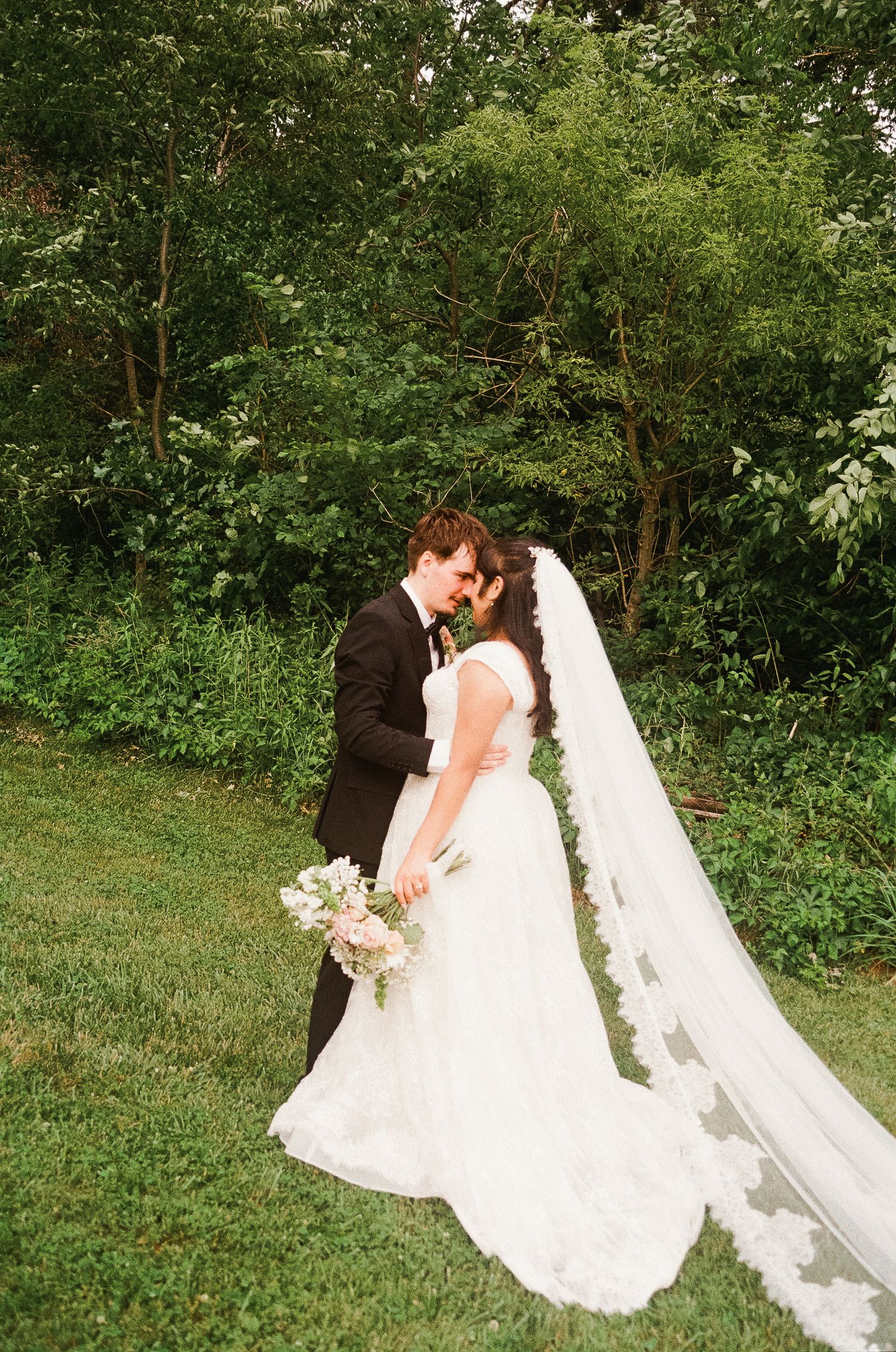 Romantic outdoor summer wedding on 35MM film photographer northern Indiana candid documentary true to life lush greens