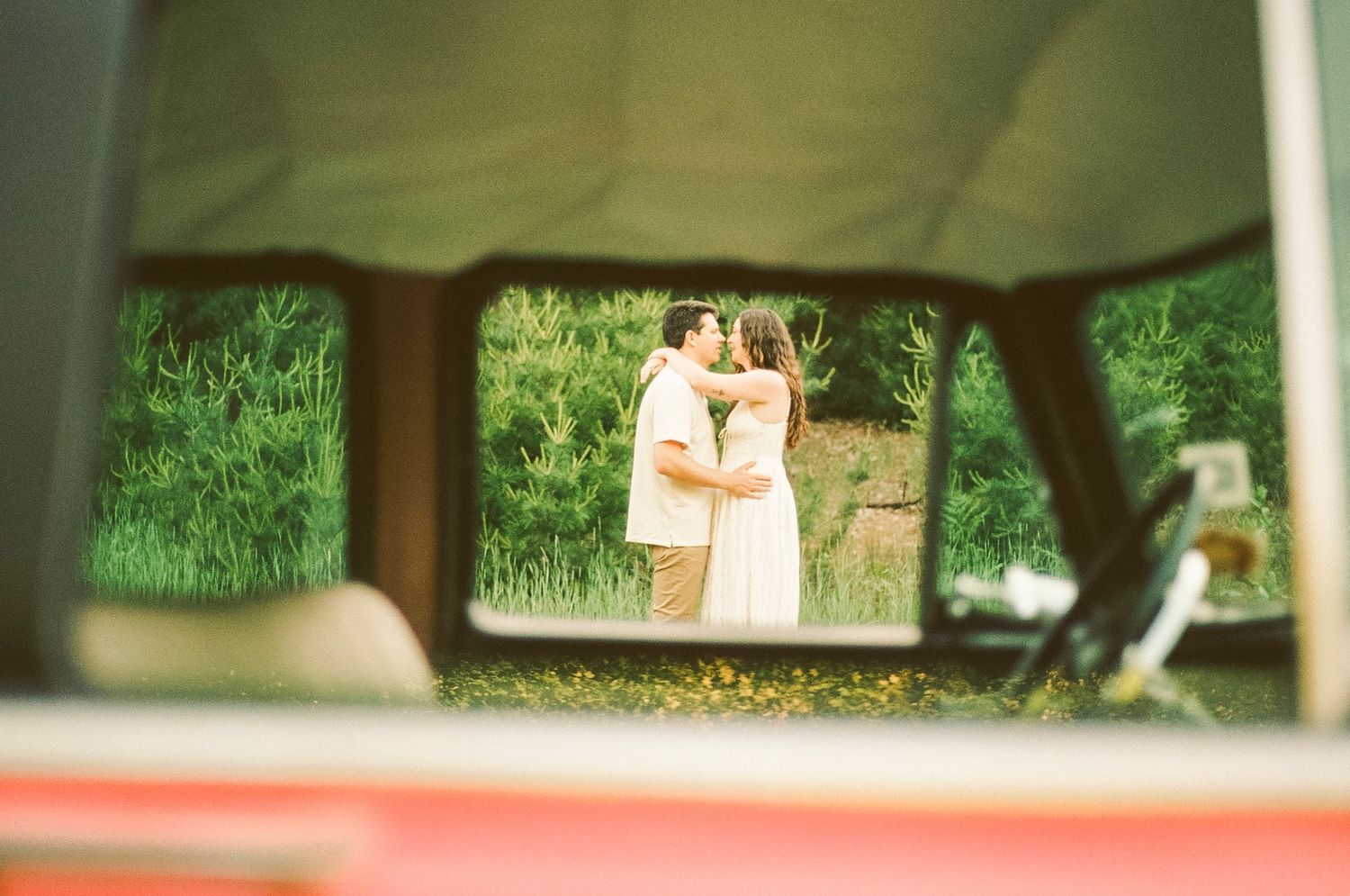 Romantic gentle summer engagement on 35MM film photographer northern Indiana candid documentary true to life golden sunlight lush greens