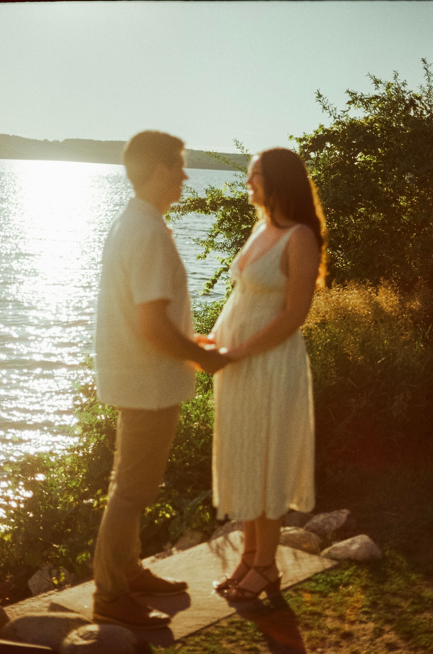 Romantic gentle summer engagement on 35MM film photographer northern Indiana candid documentary true to life golden sunlight lush greens