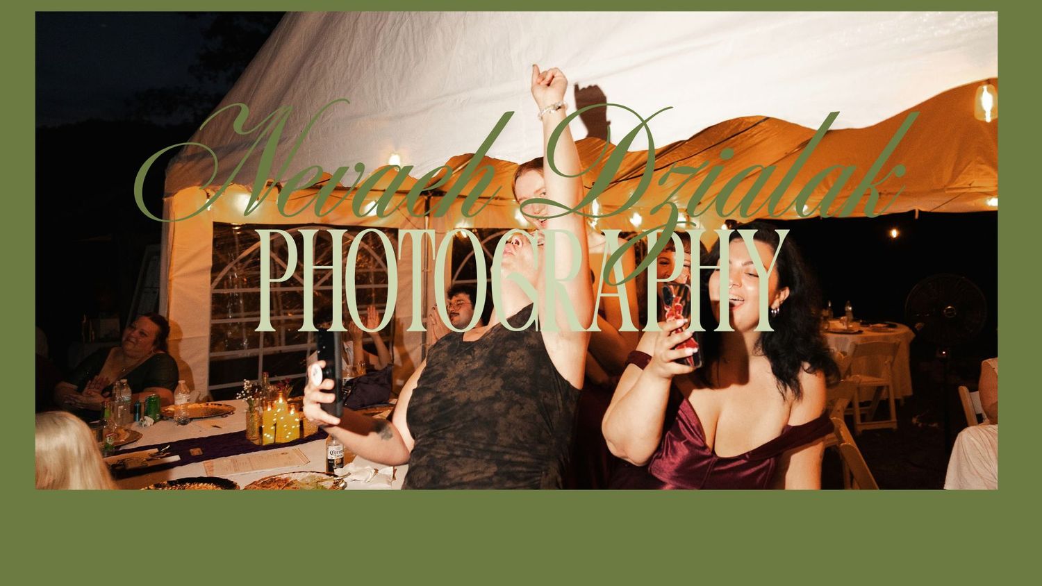 Two women dancing joyfully at an outdoor wedding reception under a tent, captured by Emerald Bridal Photography.