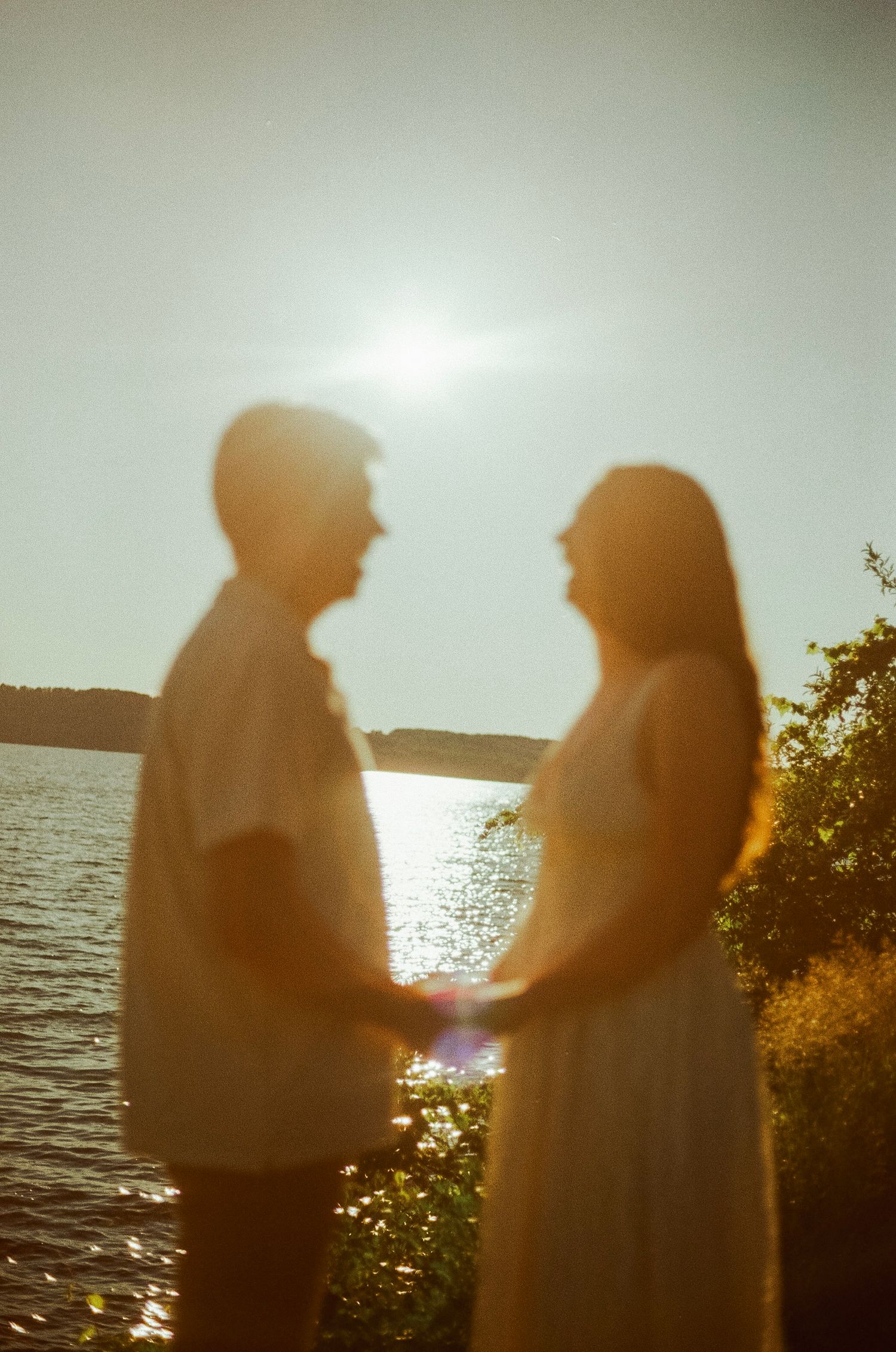 Romantic gentle summer engagement on 35MM film photographer northern Indiana candid documentary true to life golden sunlight lush greens