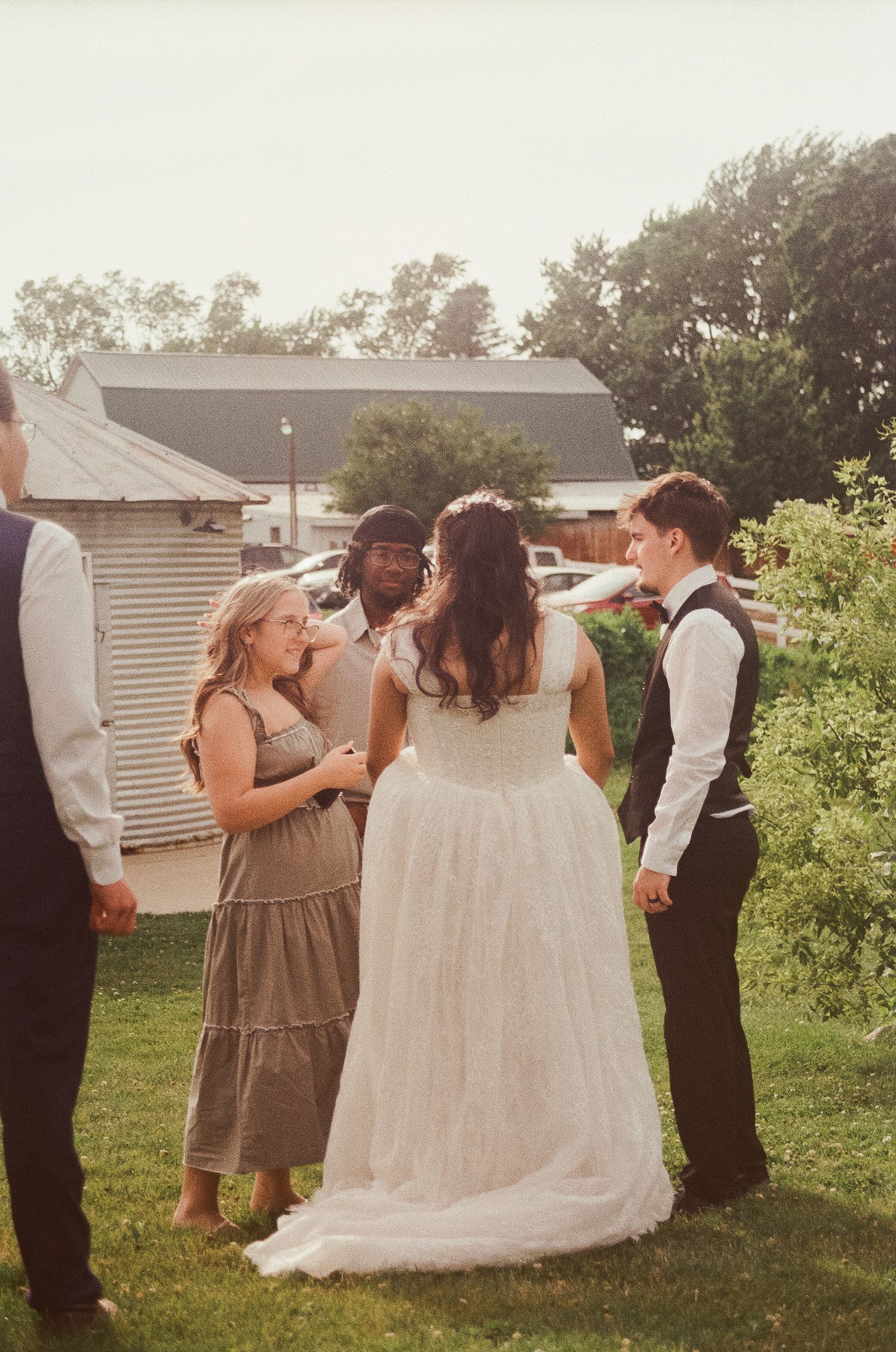Romantic outdoor summer wedding on 35MM film photographer northern Indiana candid documentary true to life lush greens