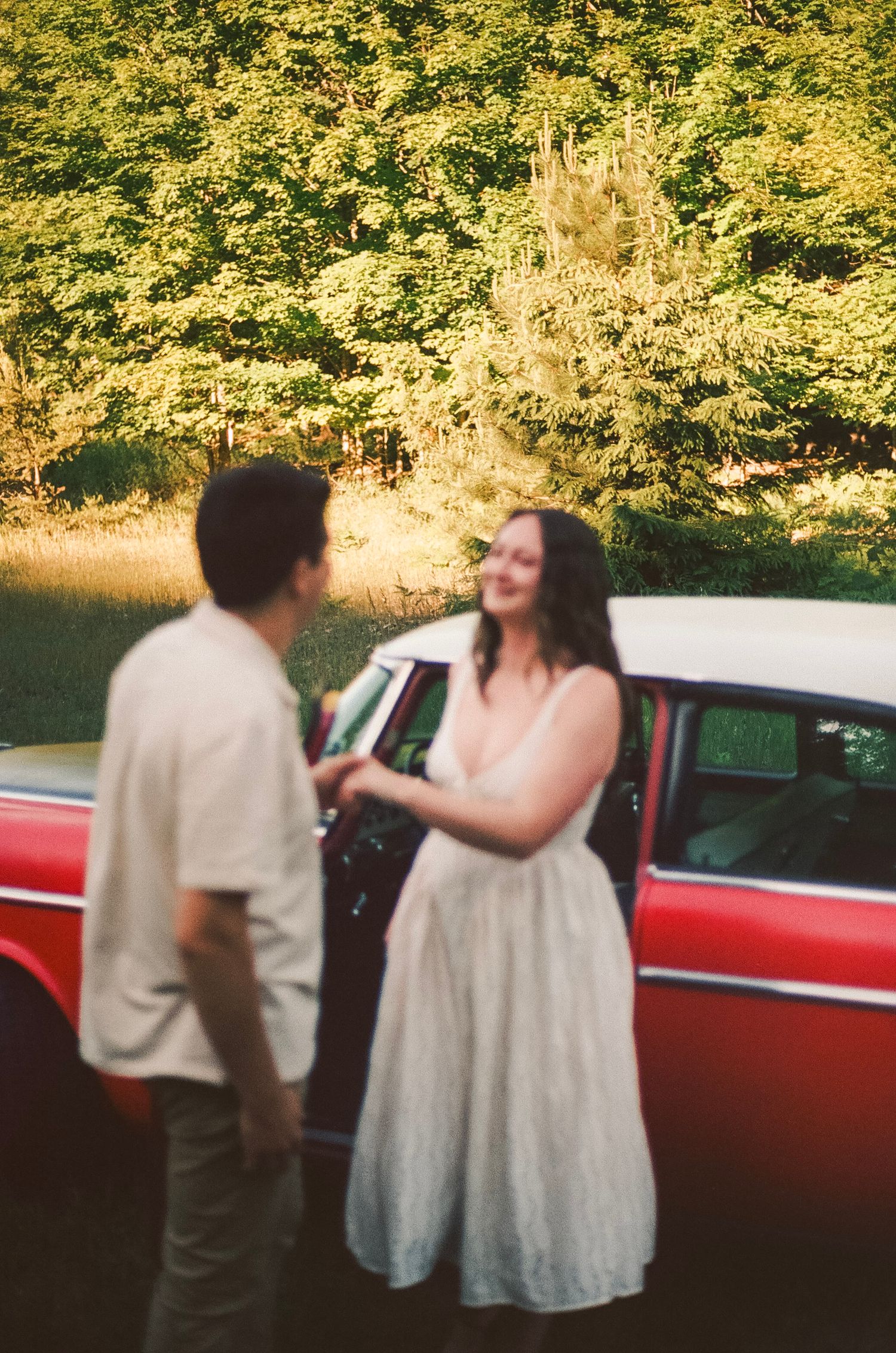 Romantic gentle summer engagement on 35MM film photographer northern Indiana candid documentary true to life golden sunlight lush greens