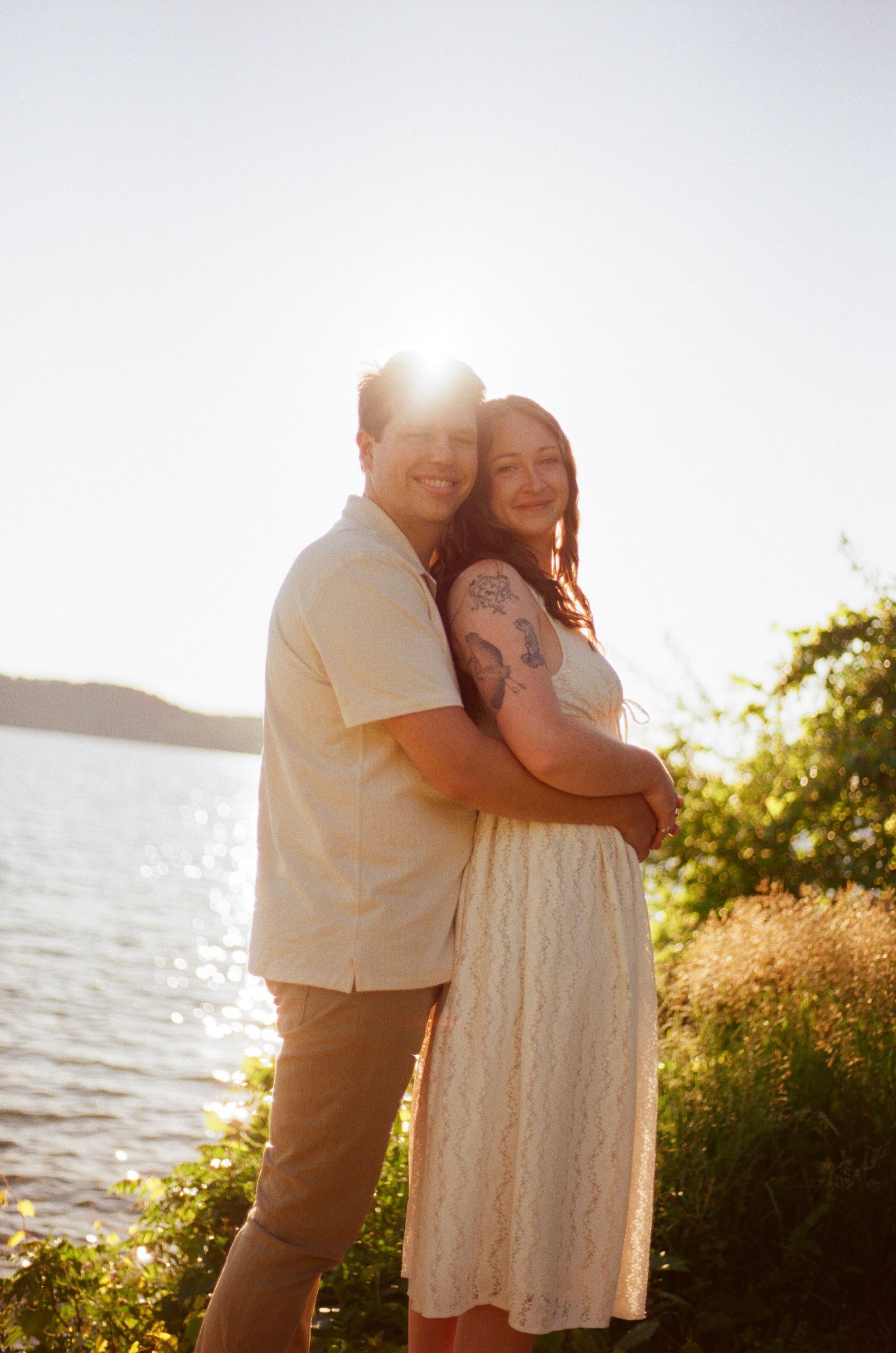 Romantic gentle summer engagement on 35MM film photographer northern Indiana candid documentary true to life golden sunlight lush greens
