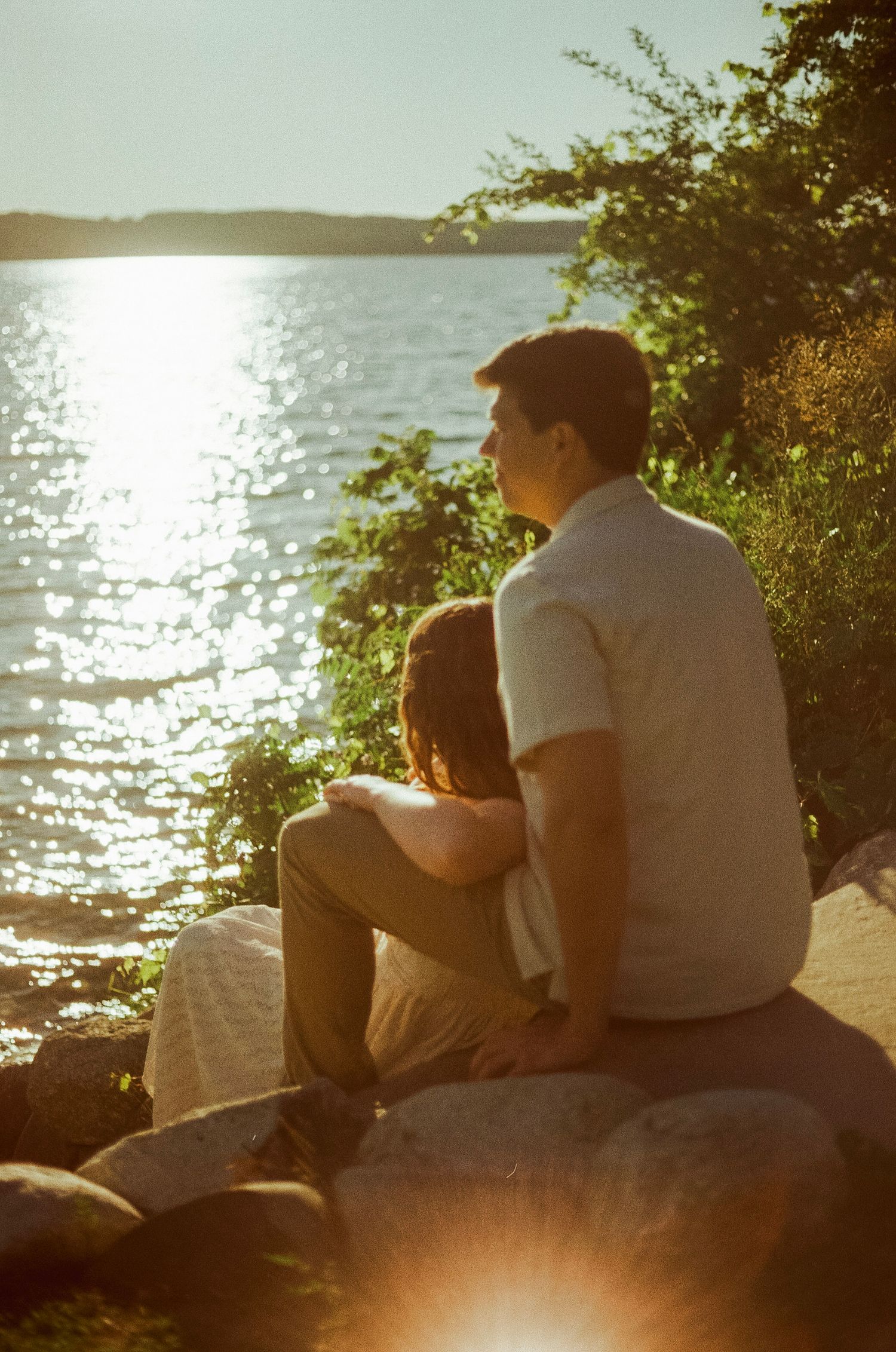 Romantic gentle summer engagement on 35MM film photographer northern Indiana candid documentary true to life golden sunlight lush greens