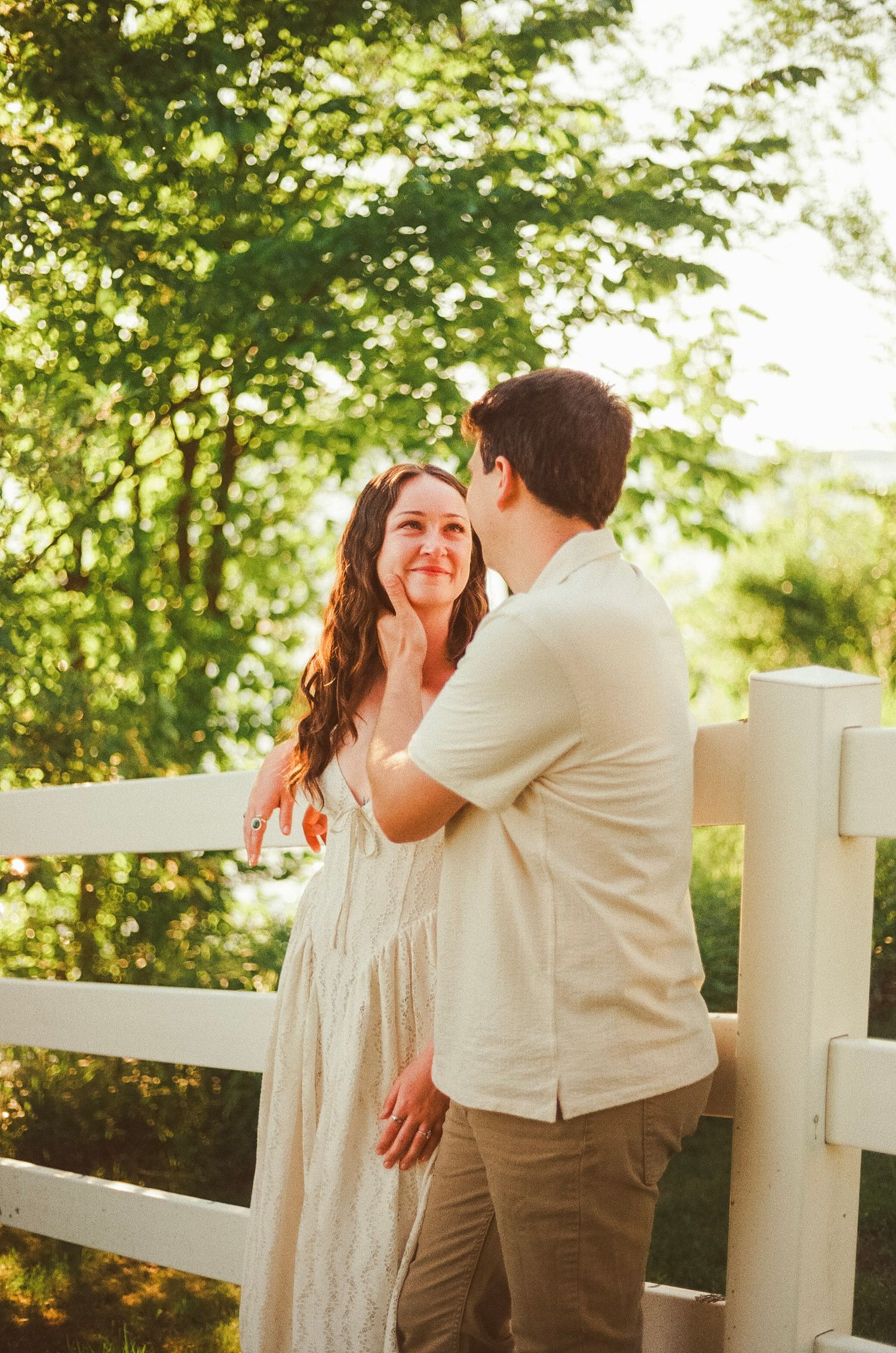 Romantic gentle summer engagement on 35MM film photographer northern Indiana candid documentary true to life golden sunlight lush greens