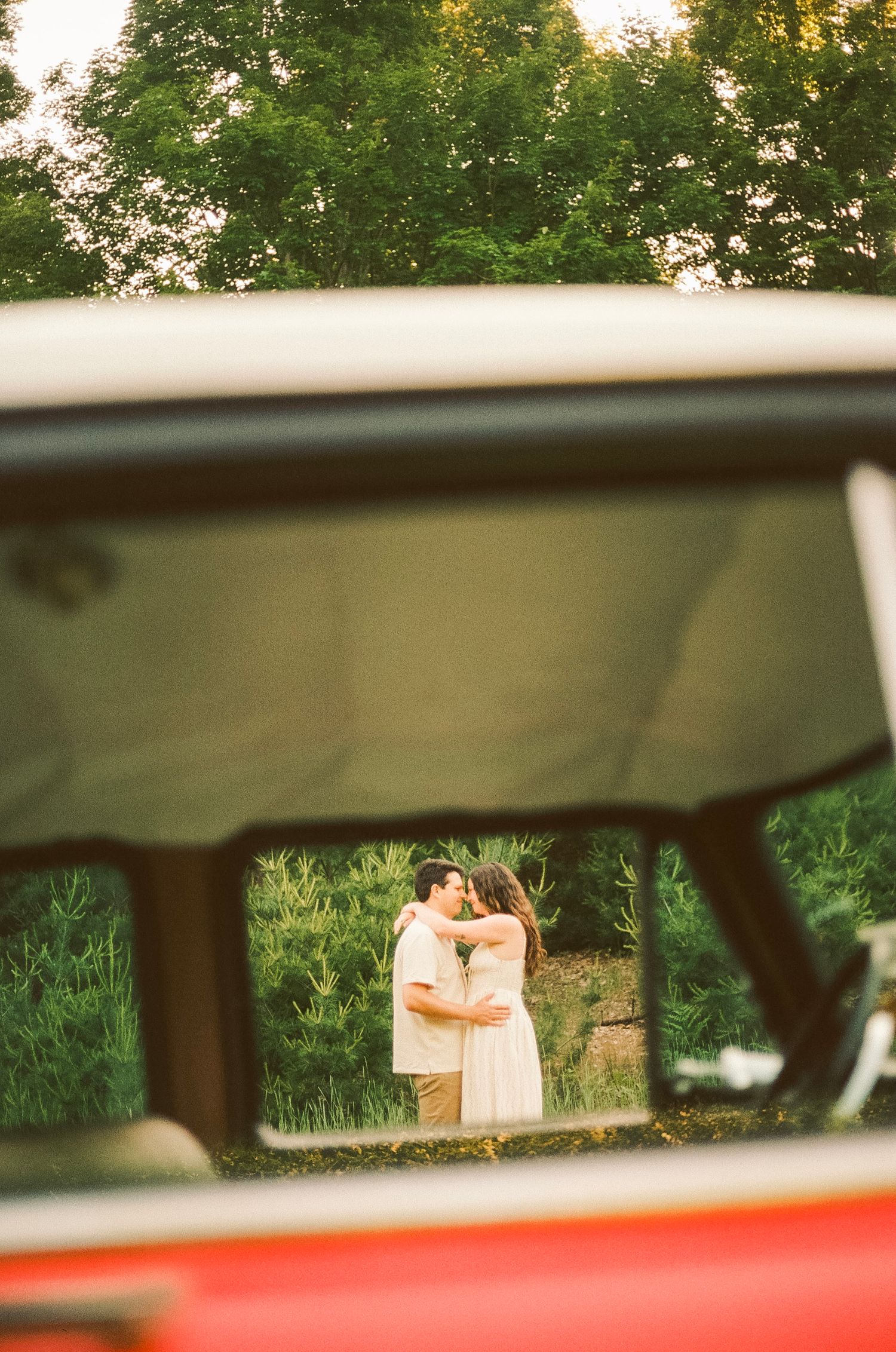 Romantic gentle summer engagement on 35MM film photographer northern Indiana candid documentary true to life golden sunlight lush greens