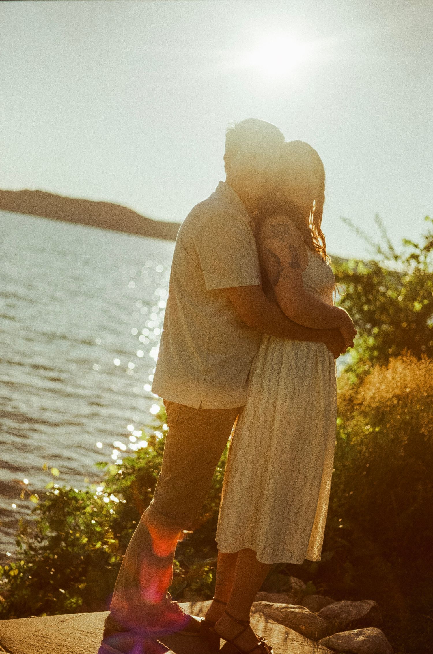 Romantic gentle summer engagement on 35MM film photographer northern Indiana candid documentary true to life golden sunlight lush greens
