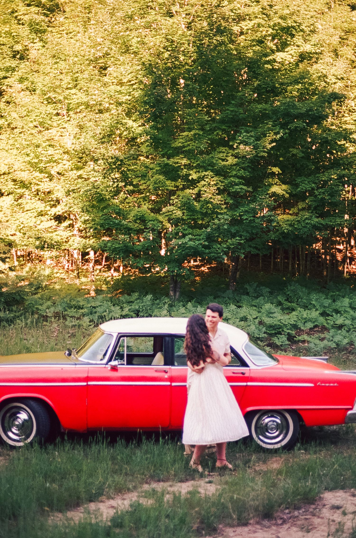 Romantic gentle summer engagement on 35MM film photographer northern Indiana candid documentary true to life golden sunlight lush greens
