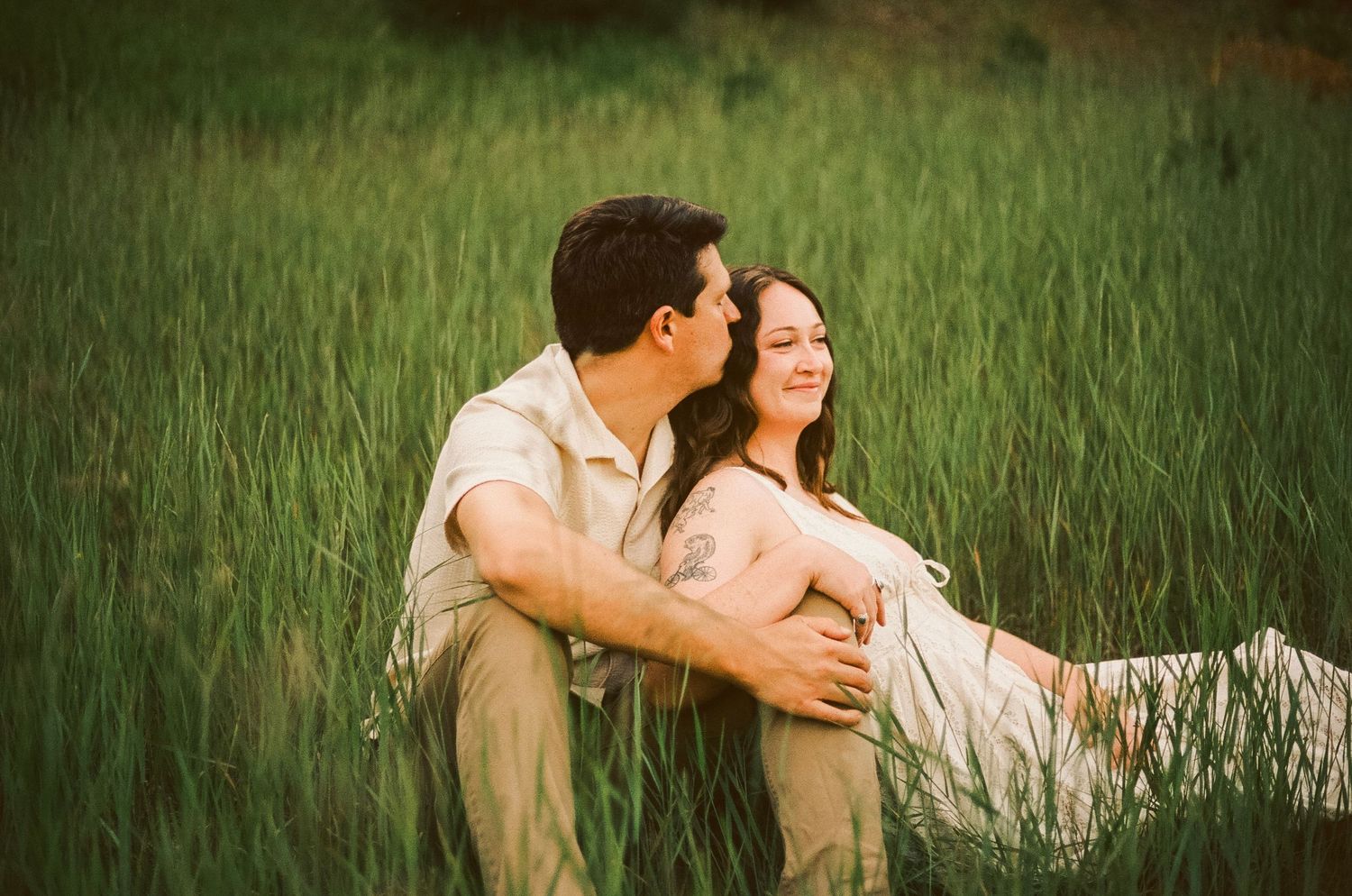 Romantic gentle summer engagement on 35MM film photographer northern Indiana candid documentary true to life golden sunlight lush greens