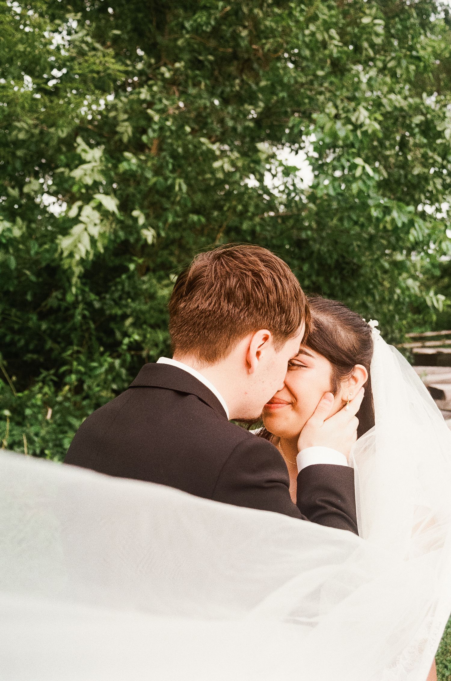 Romantic outdoor summer wedding on 35MM film photographer northern Indiana candid documentary true to life lush greens