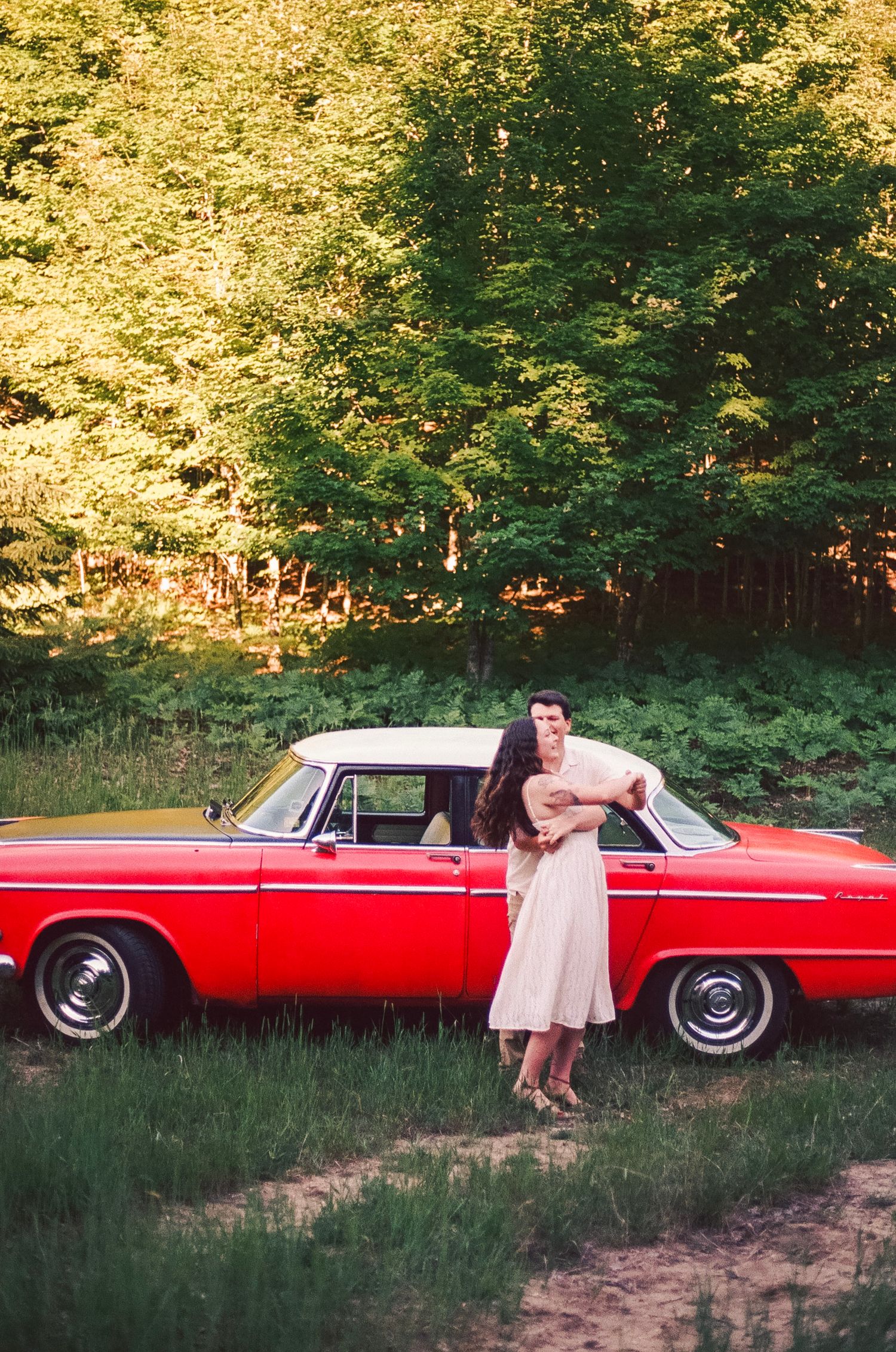 Romantic gentle summer engagement on 35MM film photographer northern Indiana candid documentary true to life golden sunlight lush greens