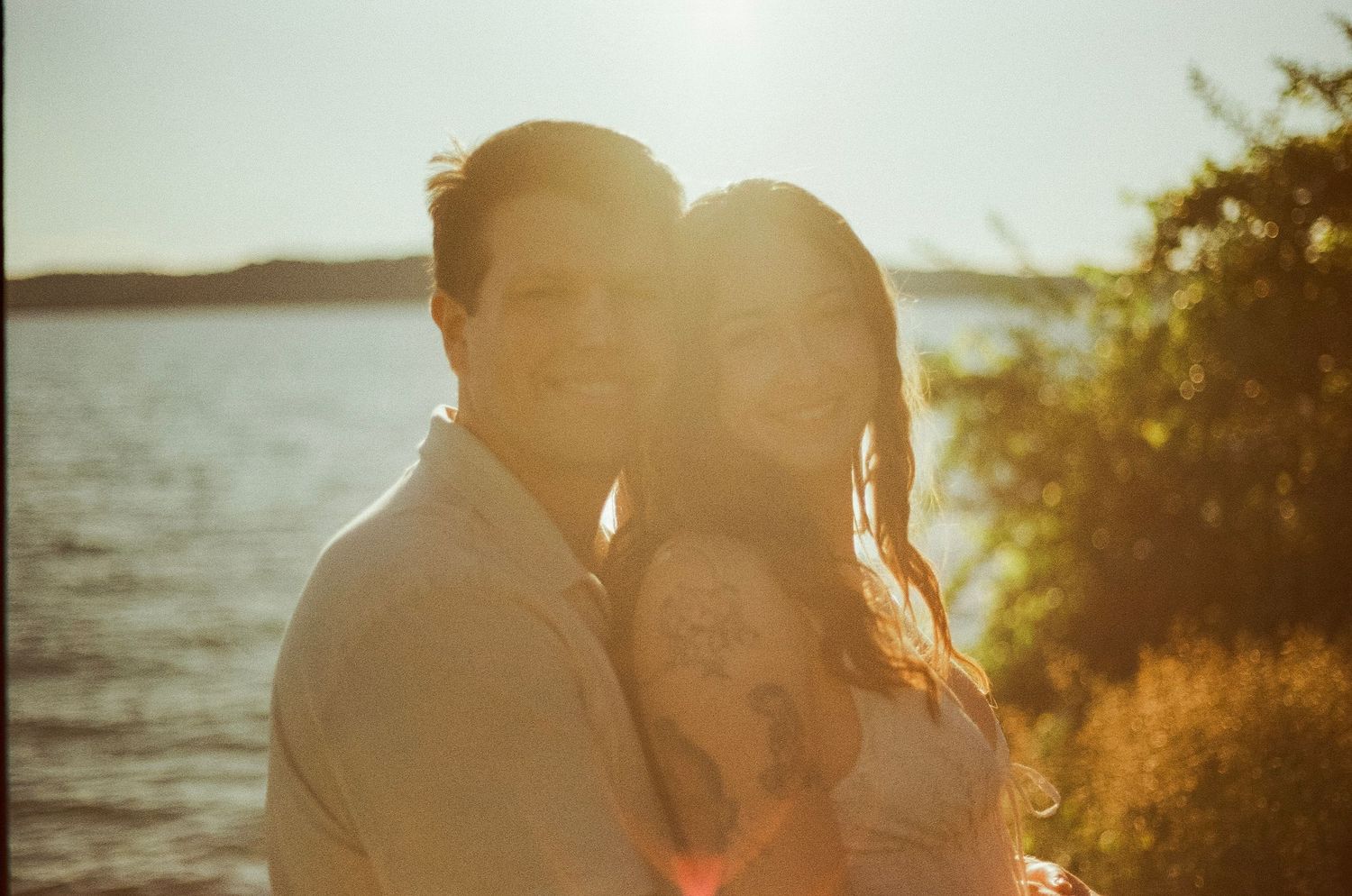 Romantic gentle summer engagement on 35MM film photographer northern Indiana candid documentary true to life golden sunlight lush greens