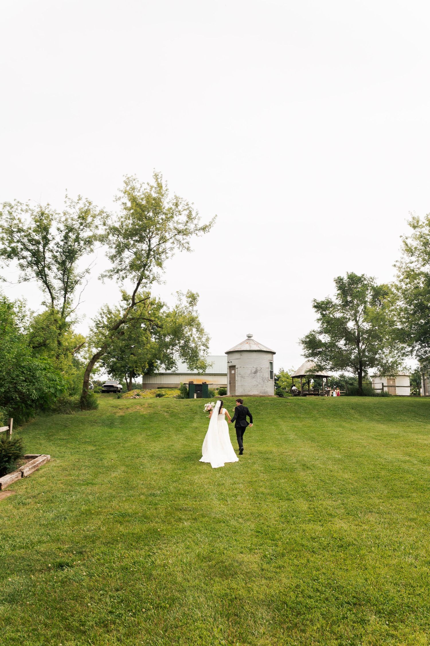 Romantic outdoor summer wedding on 35MM film photographer northern Indiana candid documentary true to life lush greens