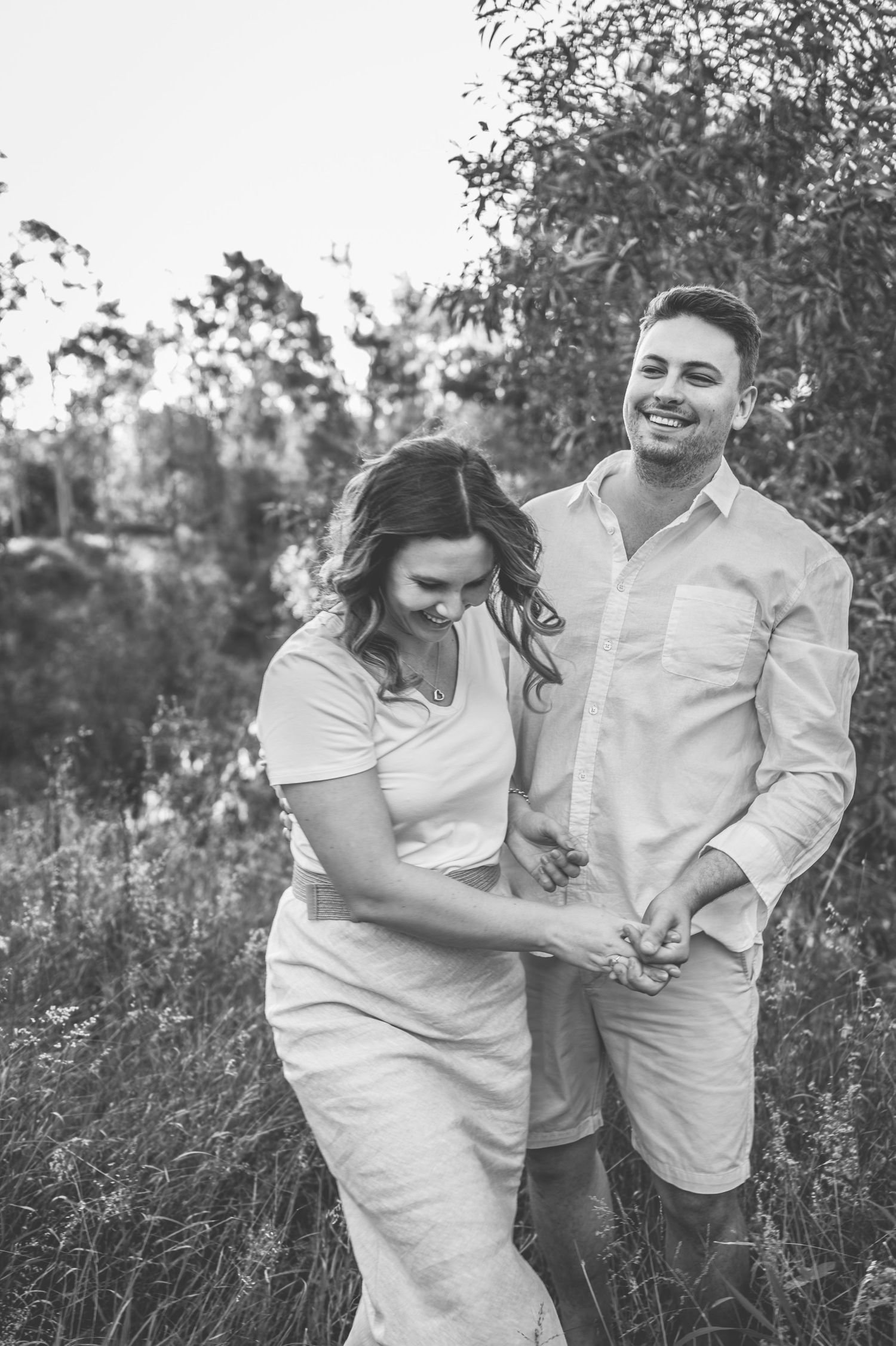Black and white sequence showing joyful moments in a natural outdoor setting.