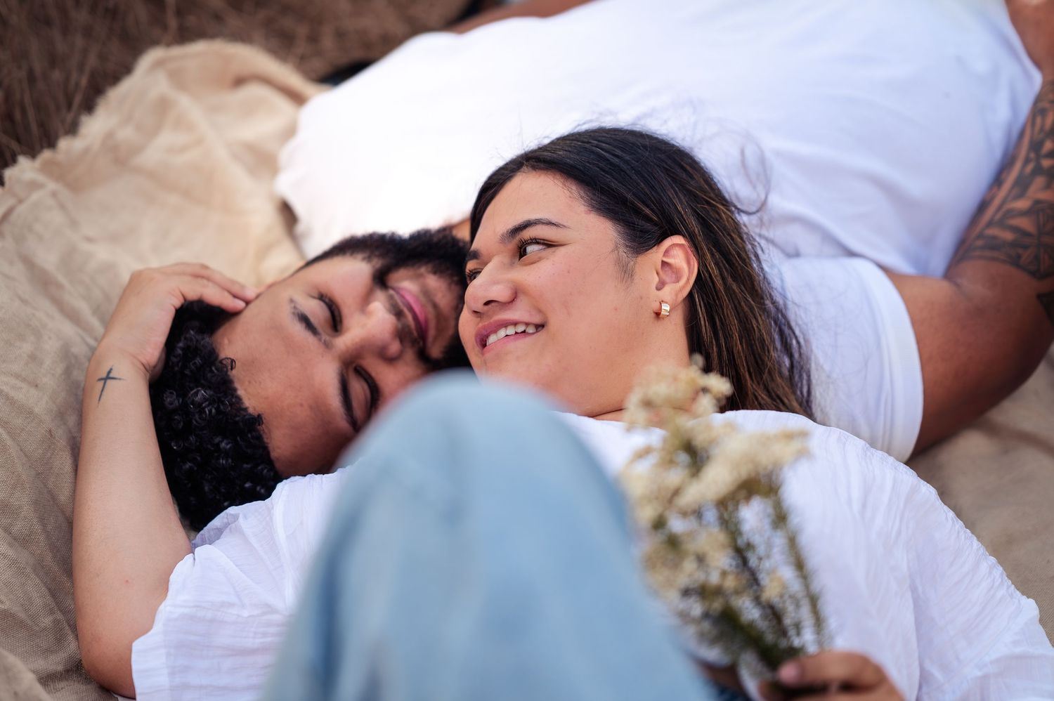 Intimate couple's portrait session with soft lighting and natural poses.
