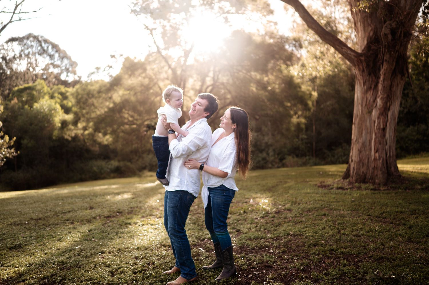 Natural outdoor family photography session in golden evening light.