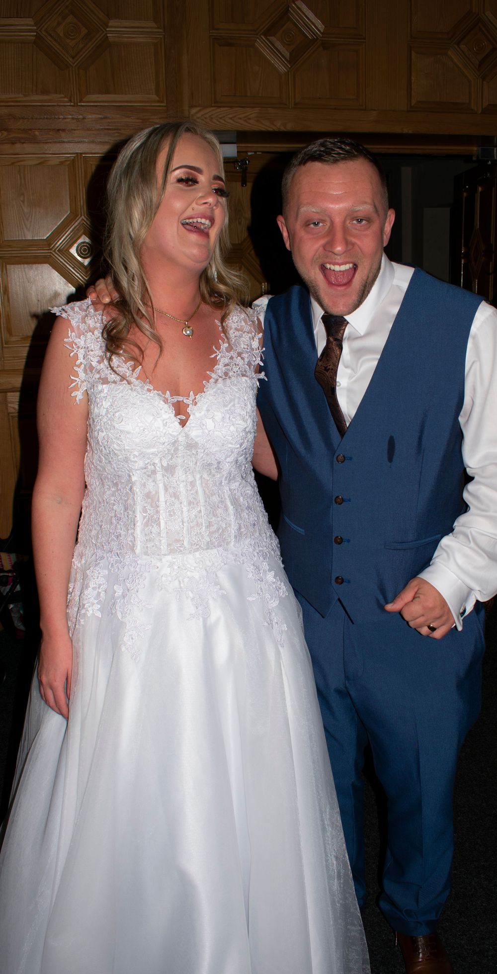 Bride and groom laughing together during their wedding celebration
