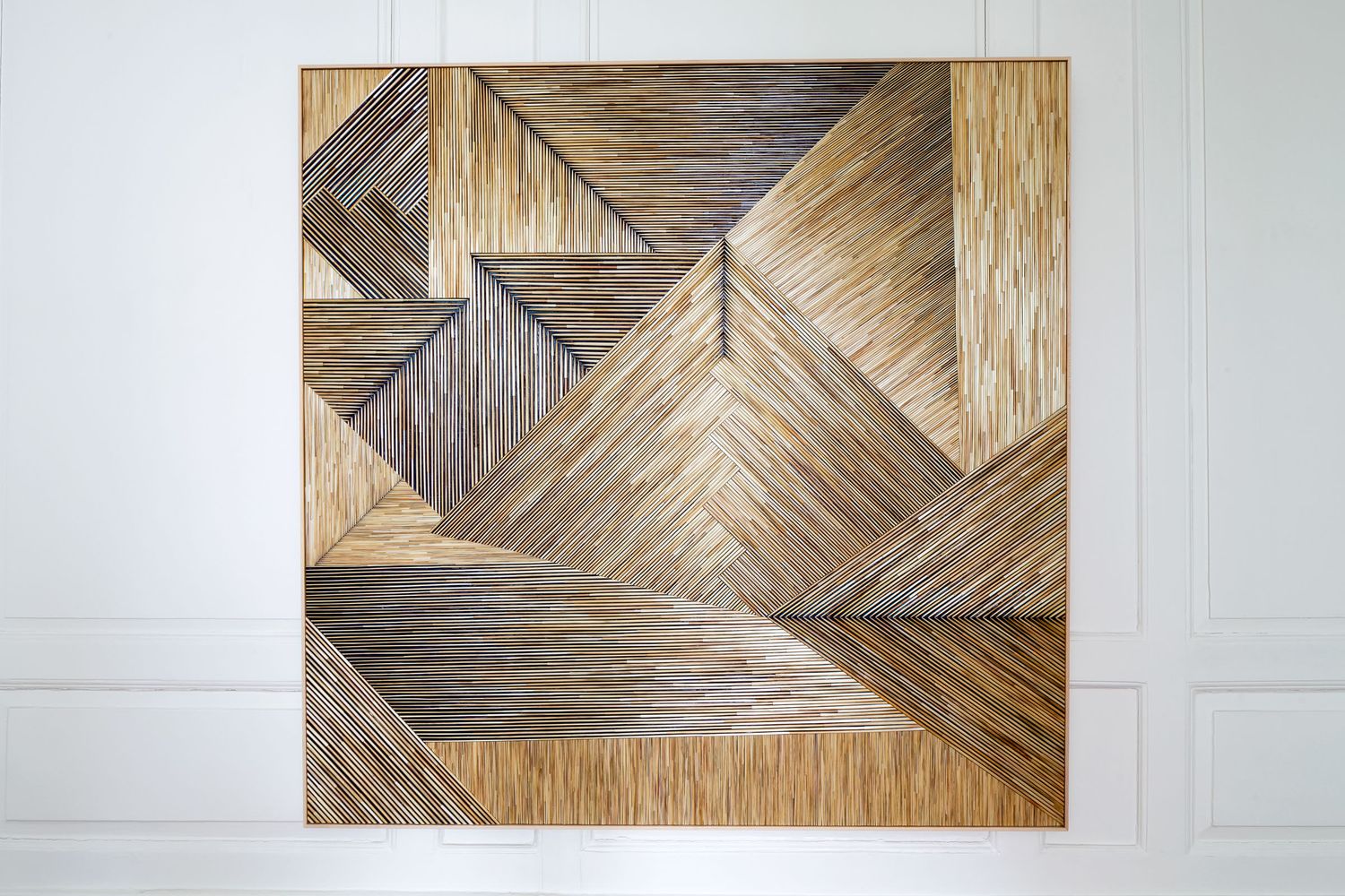 Geometric wood wall art panel featuring herringbone and chevron patterns in natural brown tones.