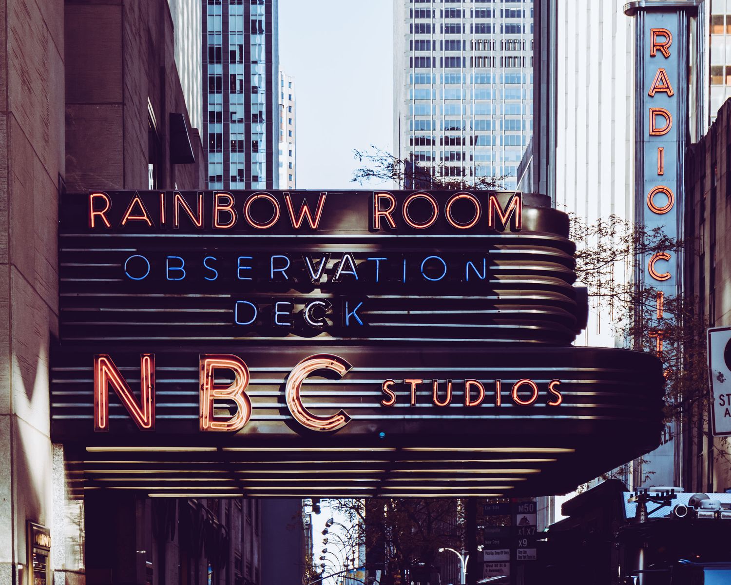Neon sign for Rainbow Room, Observation Deck, and NBC Studios at 30 Rockefeller Plaza in New York City.