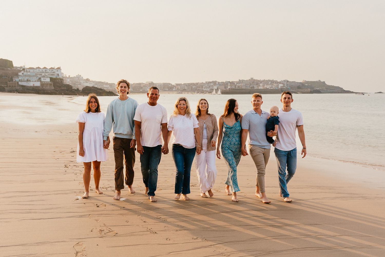 Family photo session on Porthminster Beach, St.Ives, Cornwall. Backlit, golden hour sunset, wearing a blue & white colour palette.