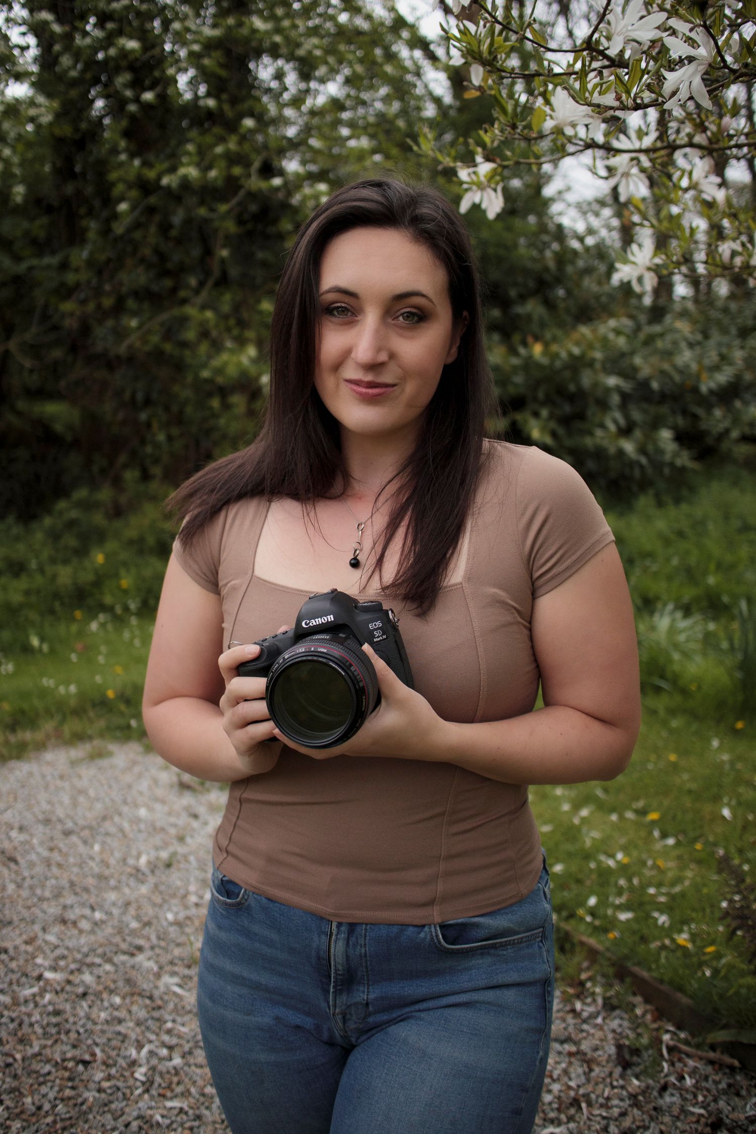 Portrait of Katie J Photography holding camera