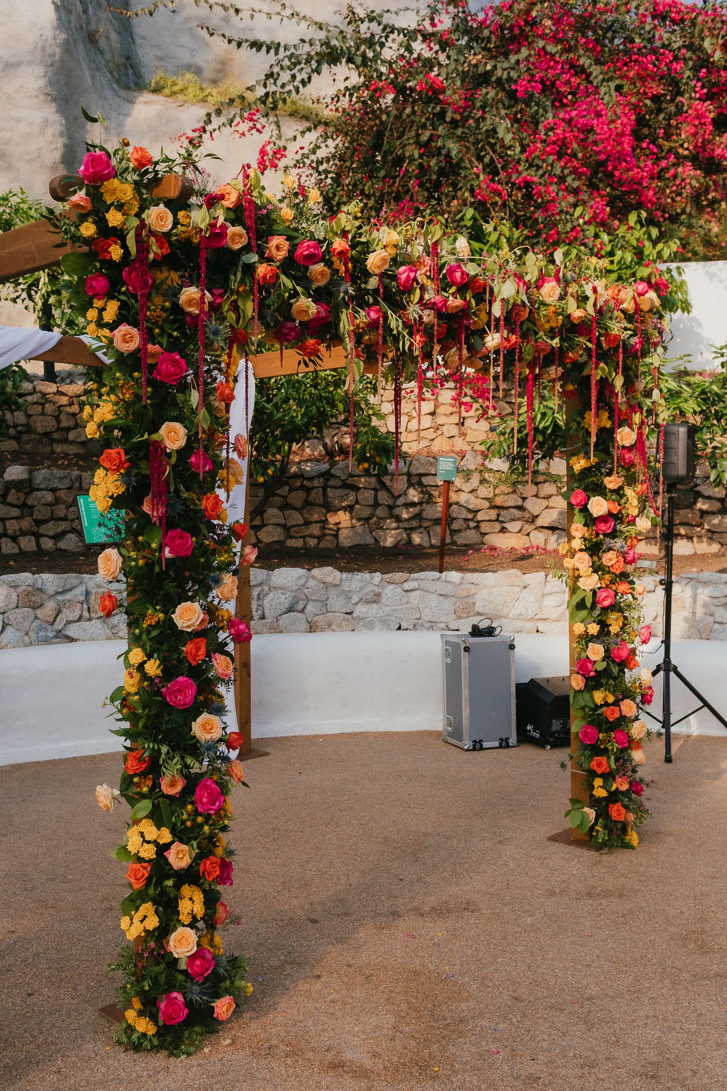 Colourful vibrant floral wedding arch Eden Project Mediterranean biome wedding