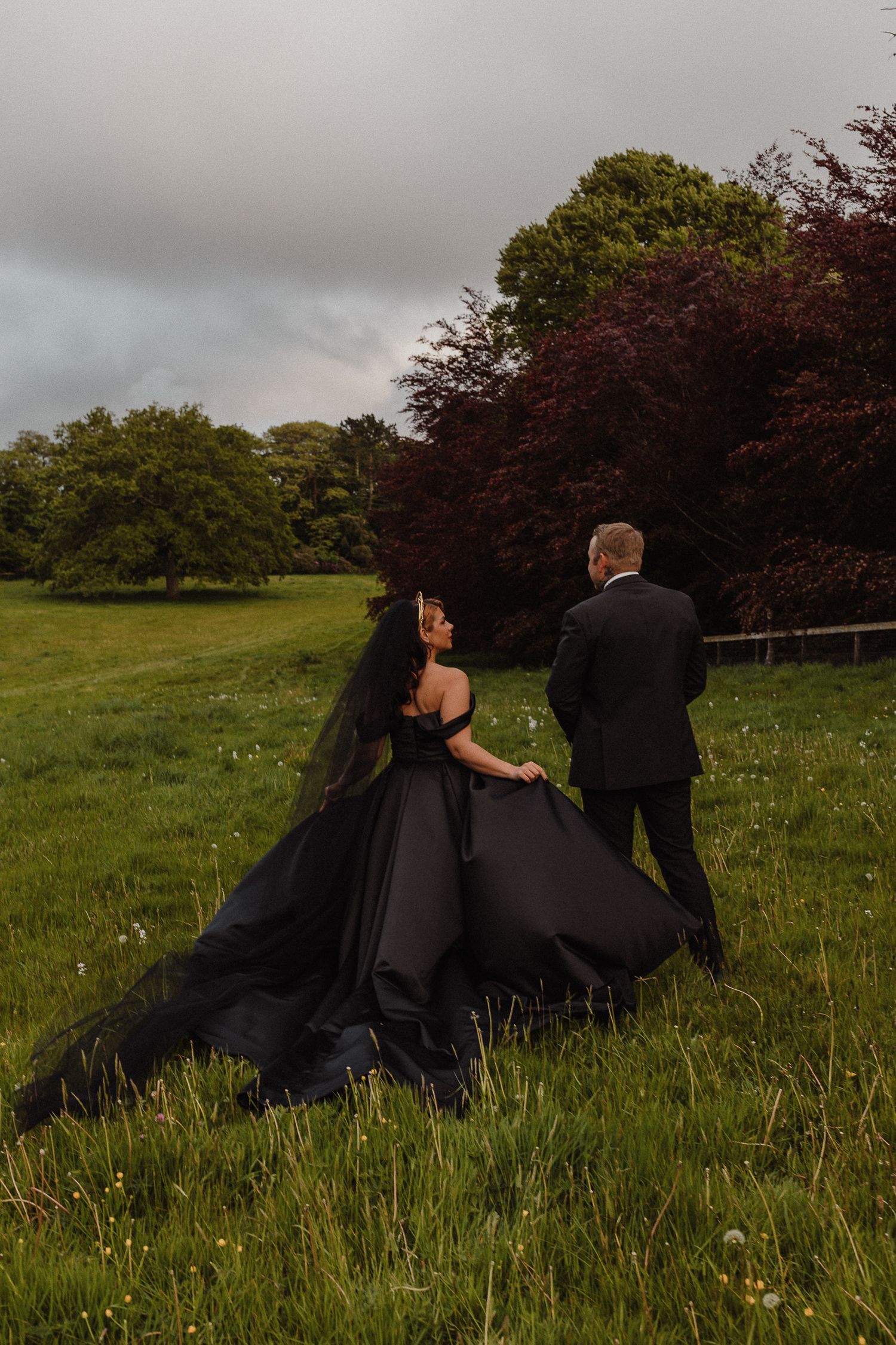 Dark Romance Alternative Style Cornwall Elopement at Scorrier House, Black Wedding Dress outside in Gardens.