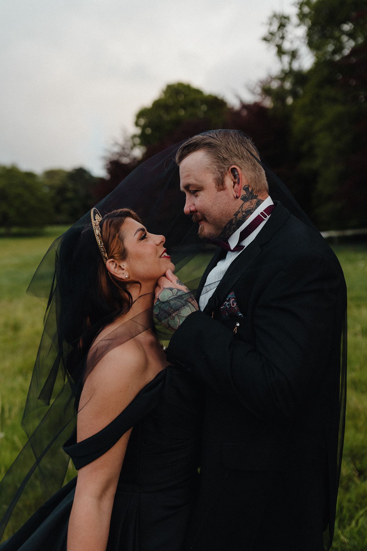 Dark Romance Alternative Style Cornwall Elopement at Scorrier House, Black Wedding Dress outside in Gardens.