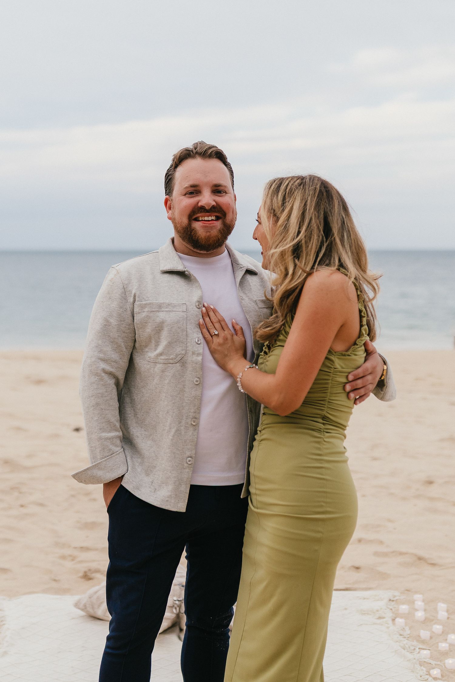 Surprise proposal on Carbis Bay Beach, Cornwall in September. Couples portrait