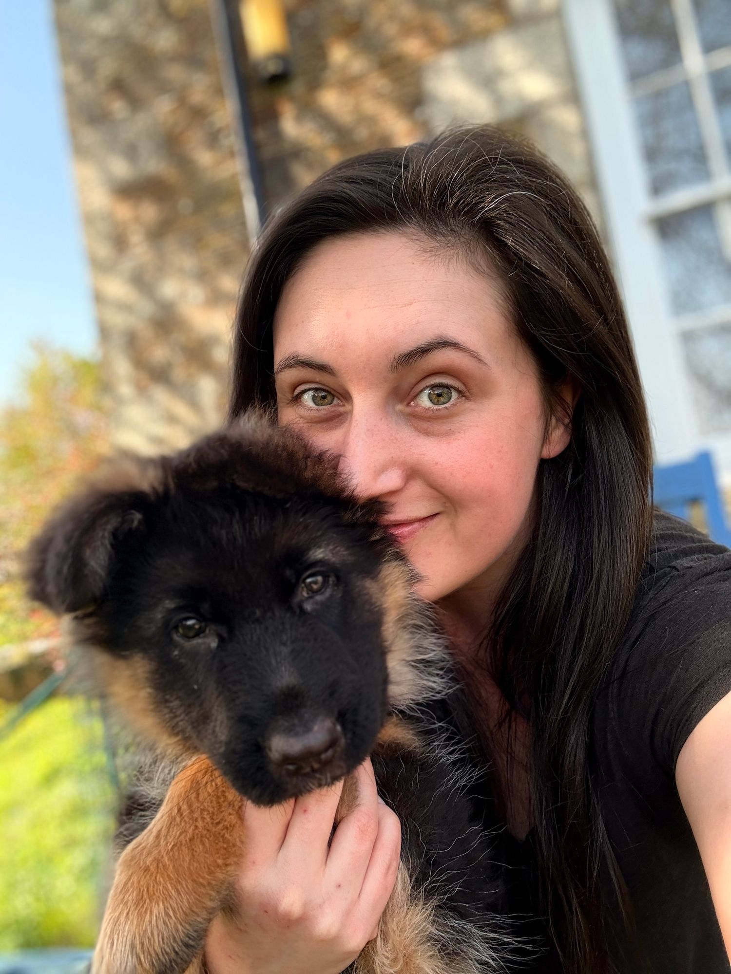 Self-portrait of Katie J with her puppy.