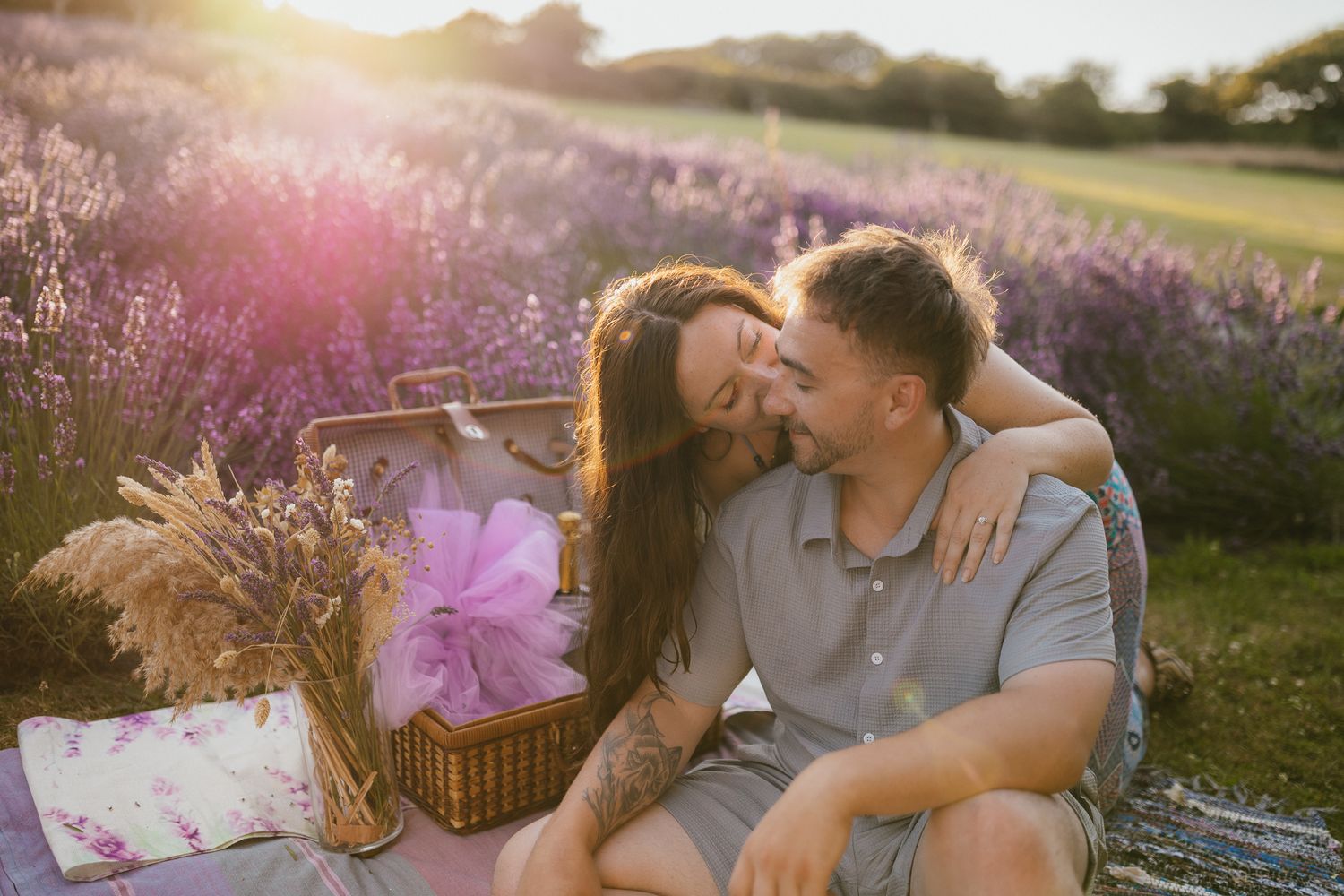 Surprise proposal at Cornish Lavender, Couples picnic. Dreamy backlit Golden hour. Colourful engagement photos.