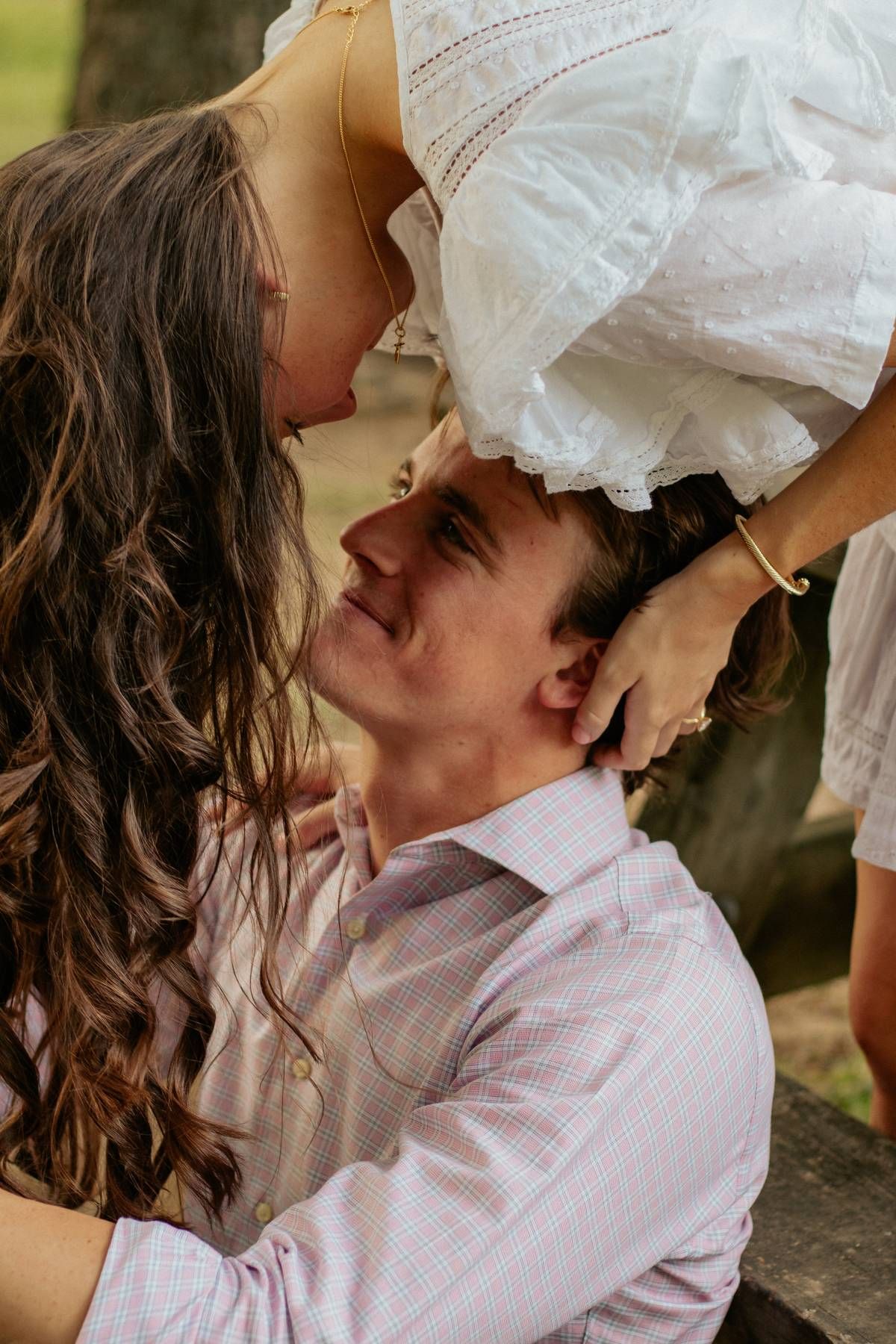 a engaged couple looking at each other during their photo session