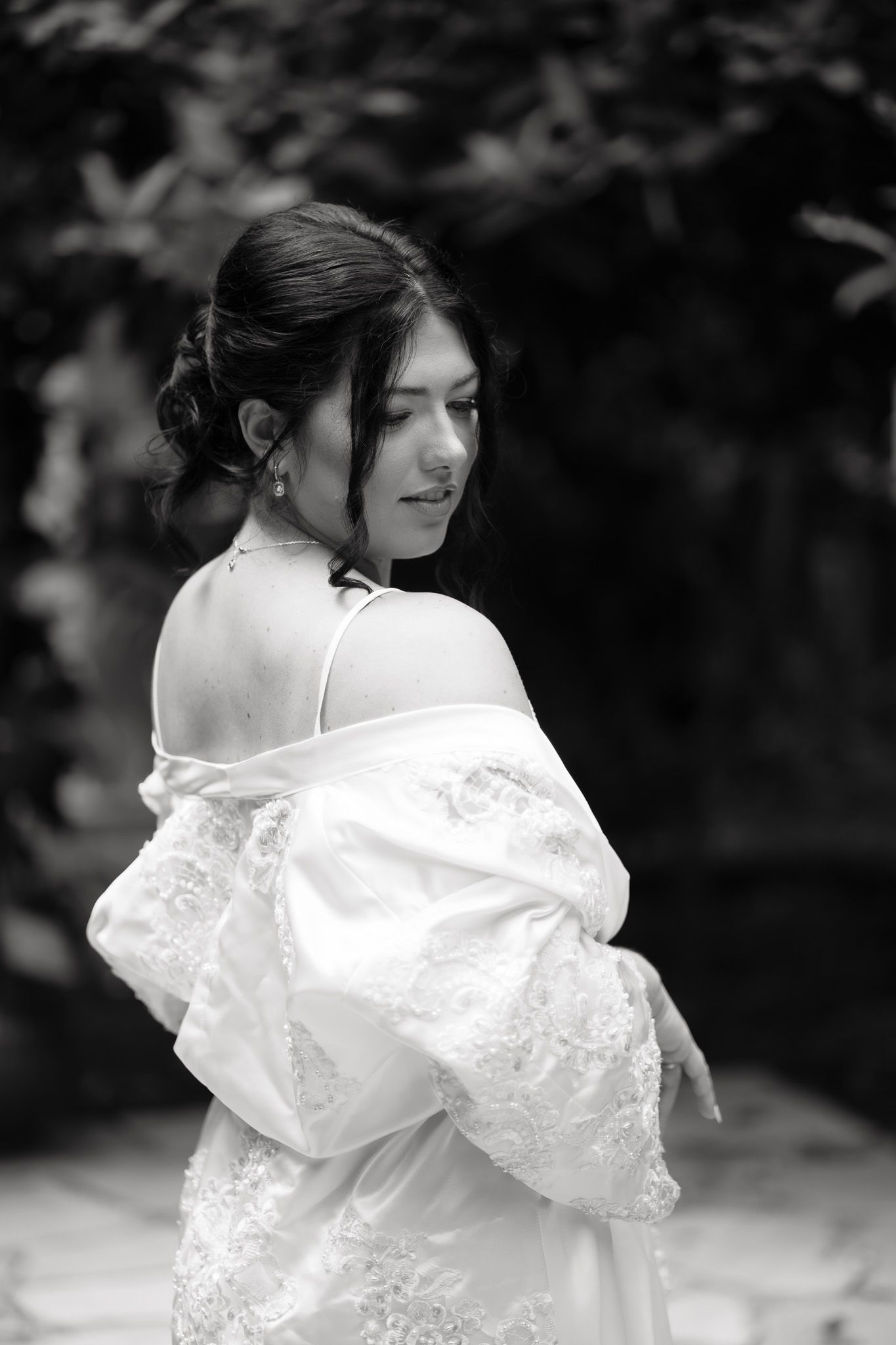 a bride in her getting ready gown on her wedding day
