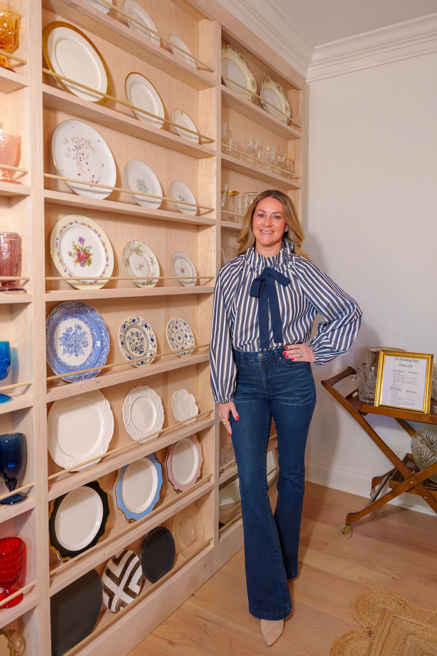 a small business owner standing next to her products