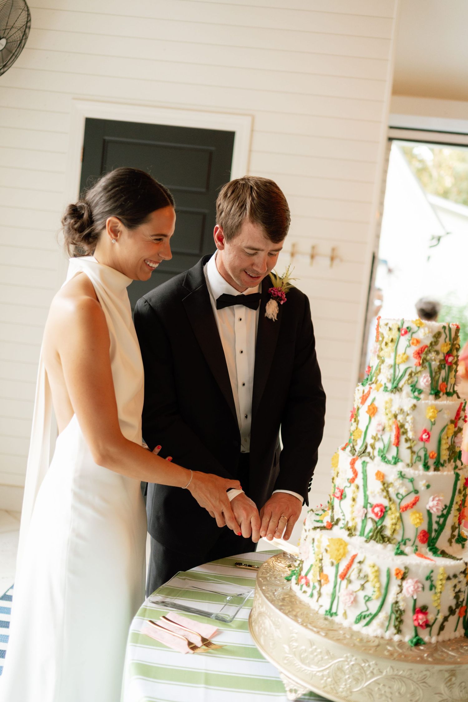couple cutting wedding cake