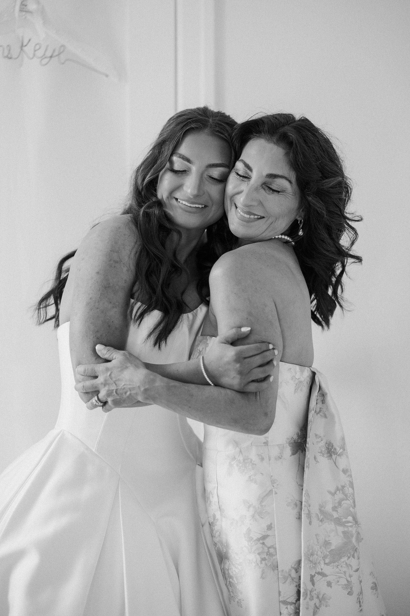 a mom and daughter hugging