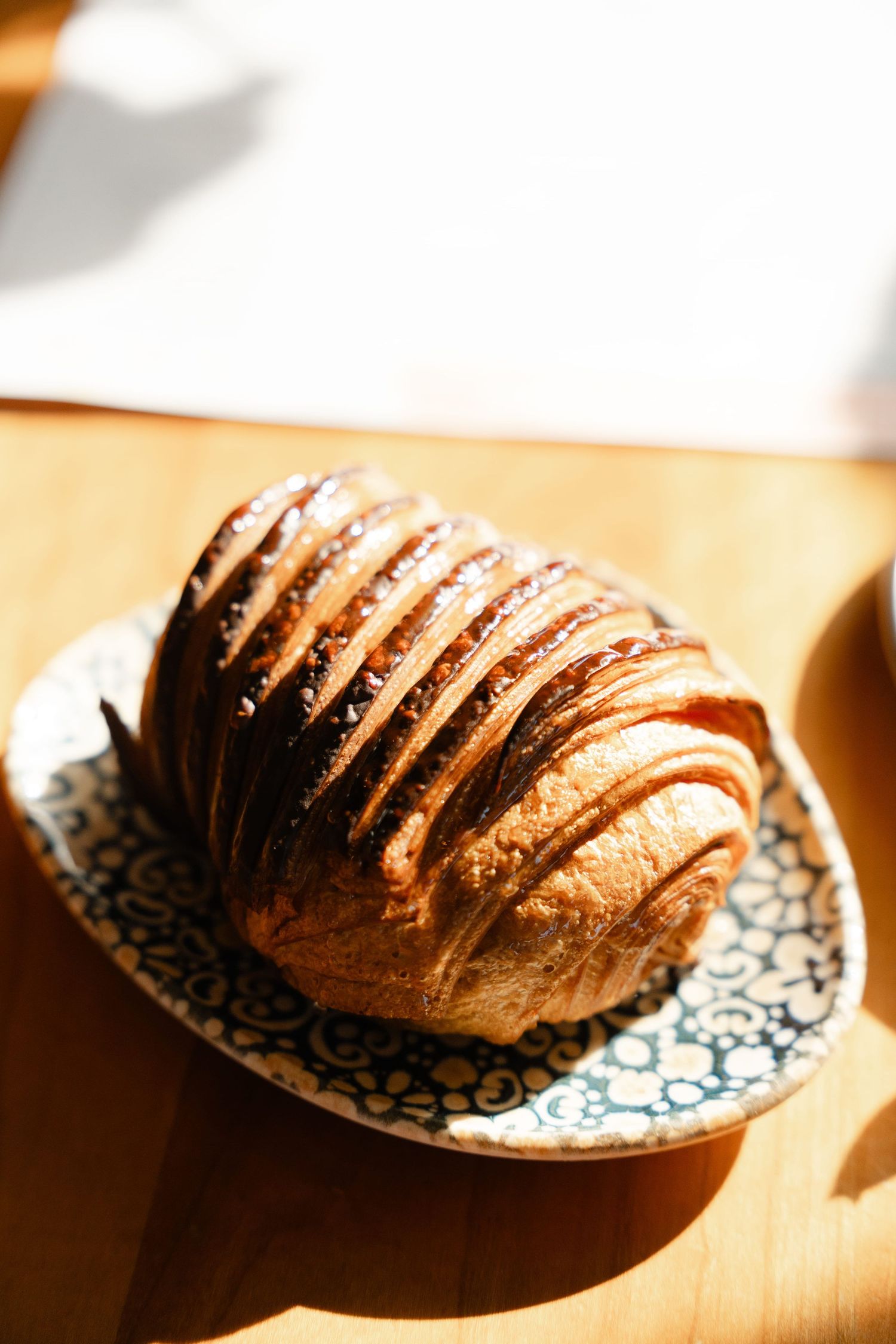 a chocolate croissant on a table