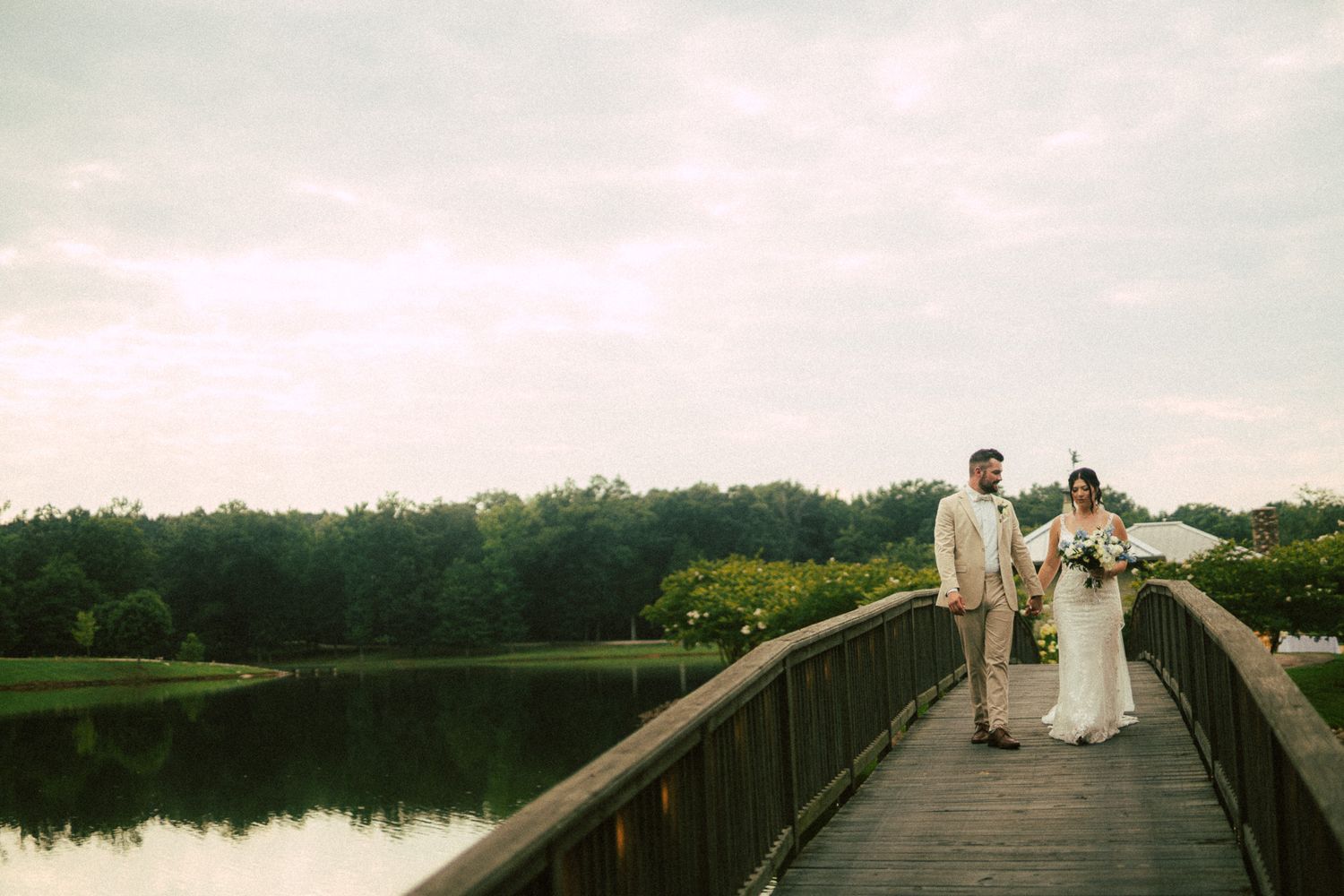 newlywed couple on bridge