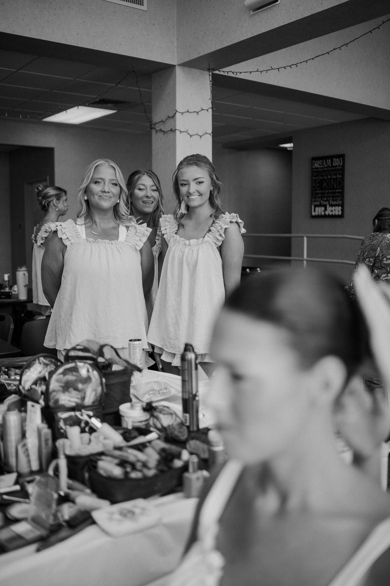 friends watching bride get ready