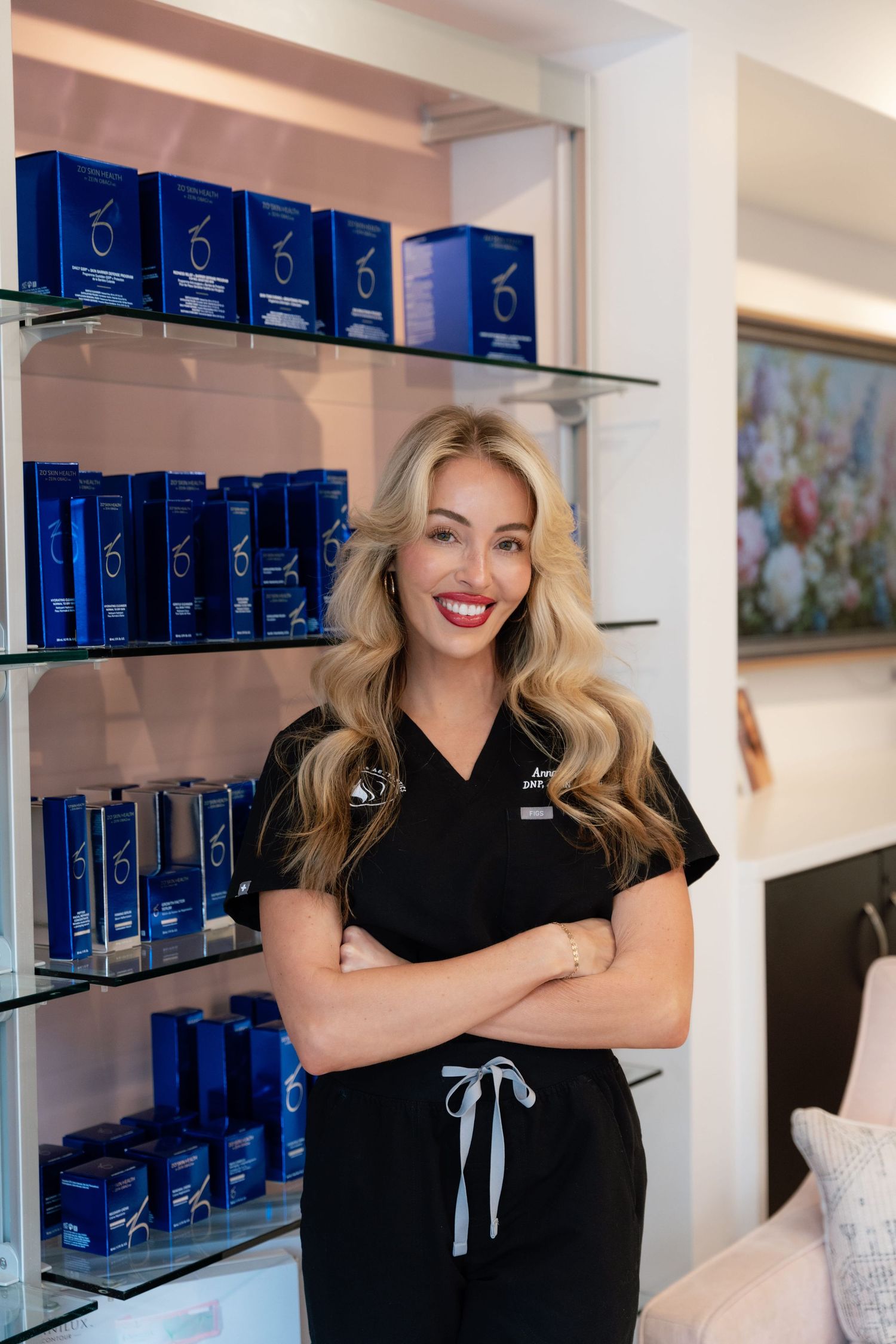 a brand owner standing in front of product smiling