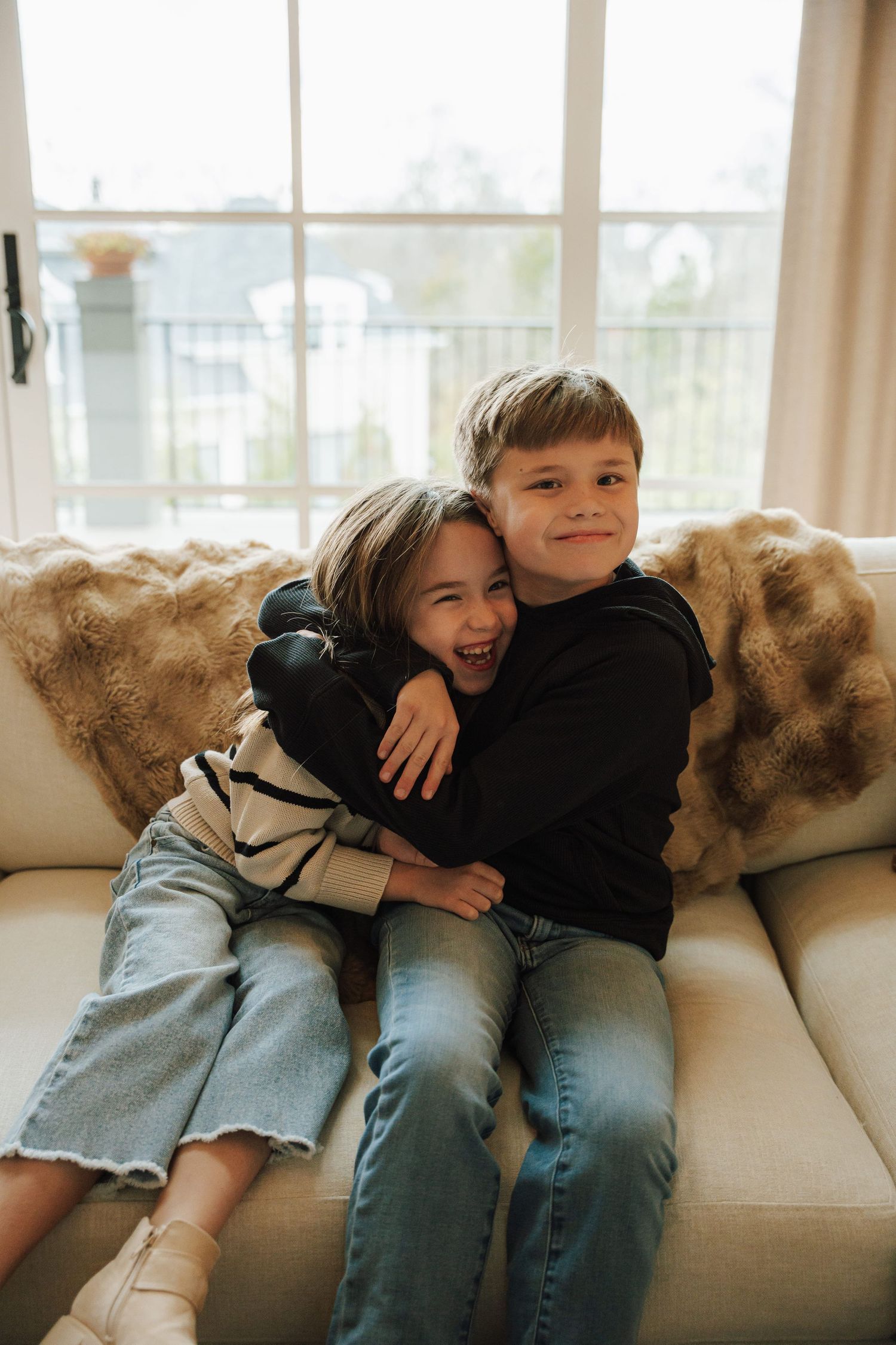 a brother hugging his sister