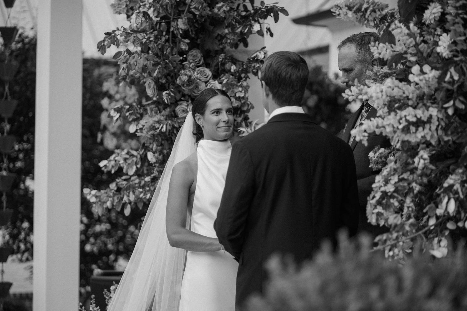 a bride and groom staring at each other