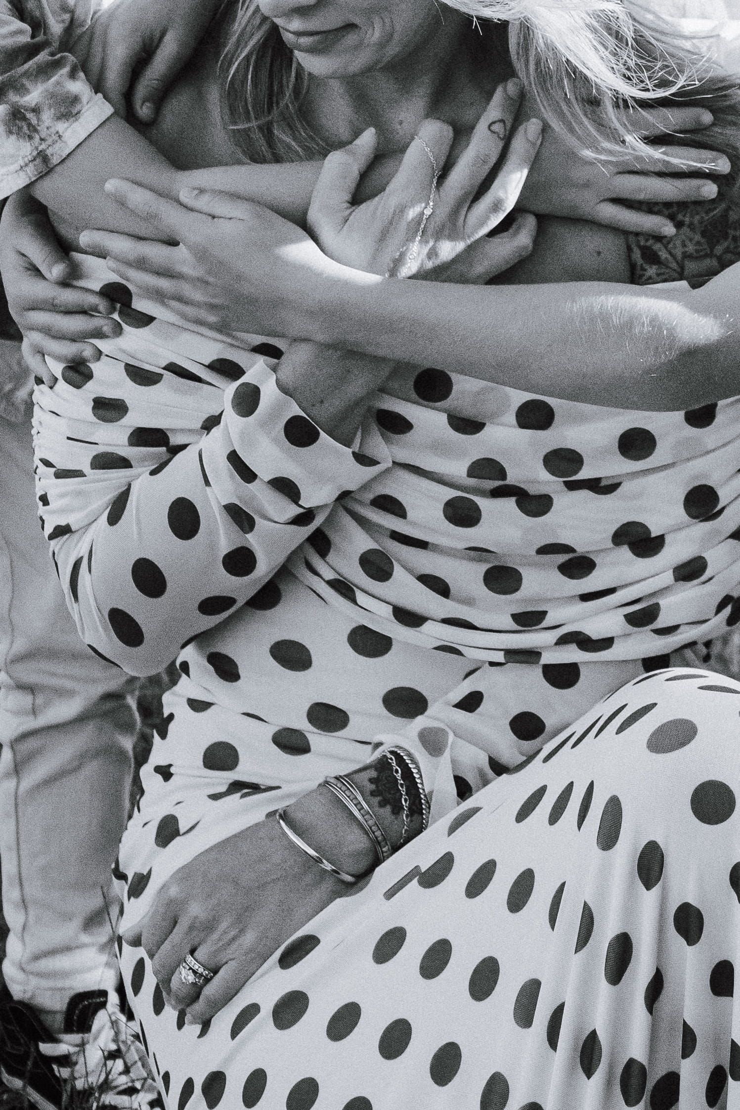 children hugging their mother