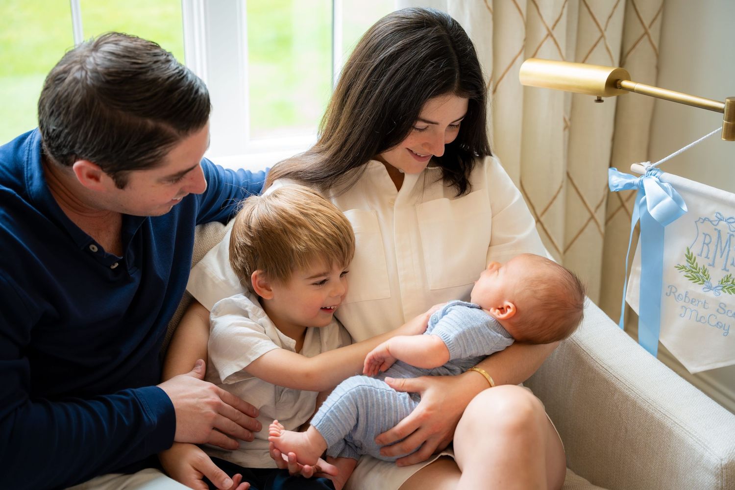 a family holding a newborn