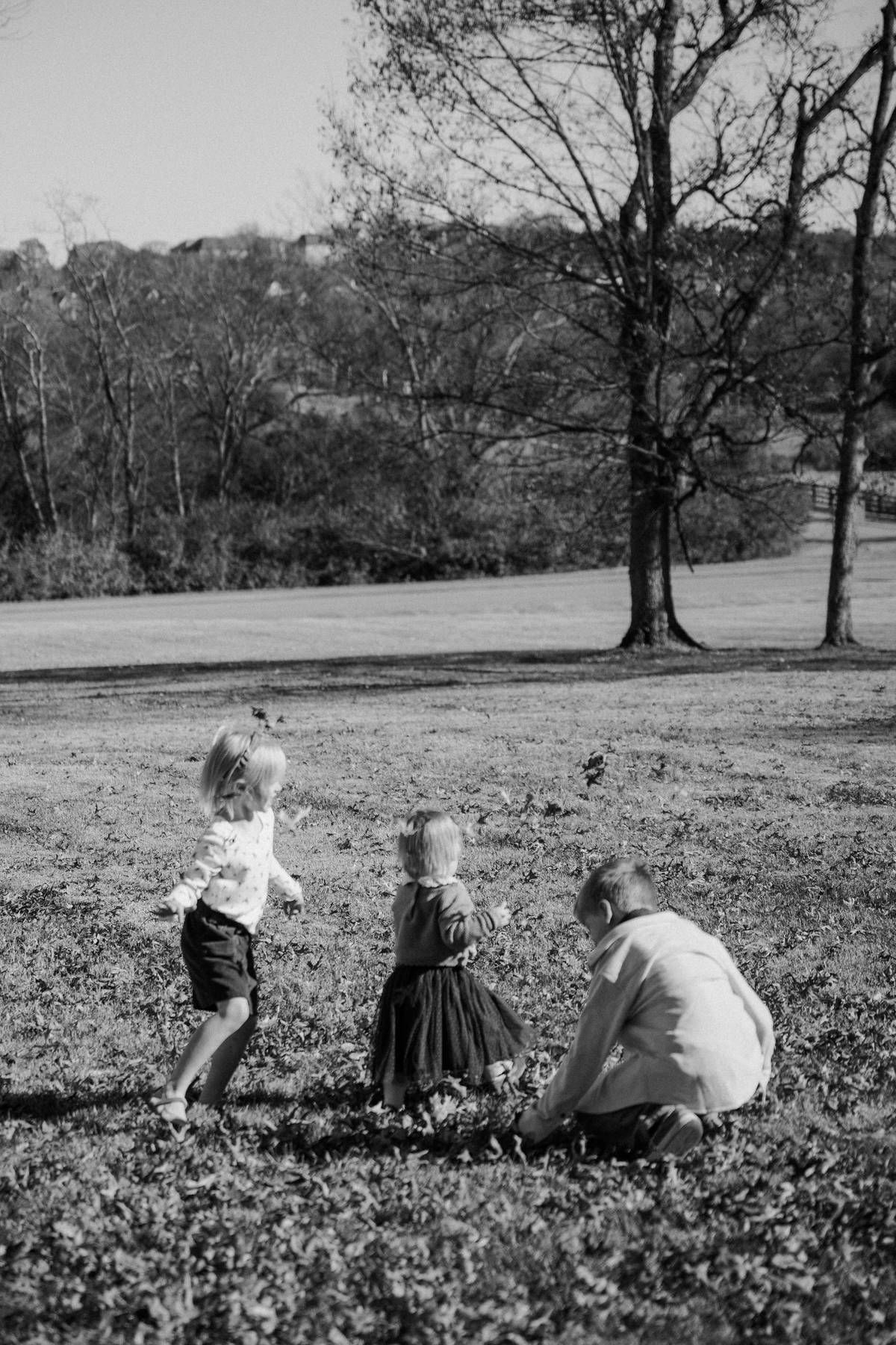 kids playing in a grassy field